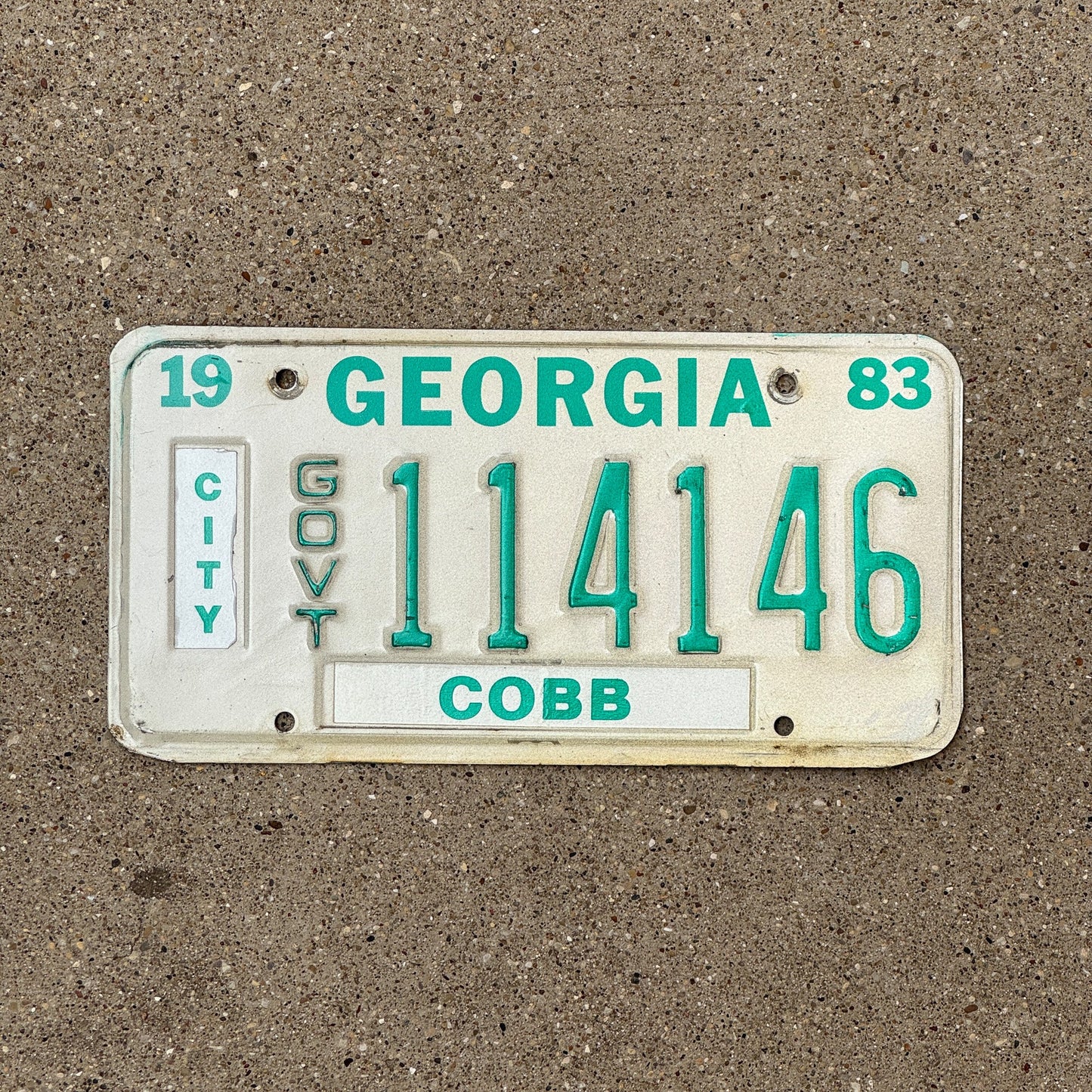 Photo of a 1983 Georgia City Government License Plate Auto Tag Garage Decor Vintage Cobb County 114146