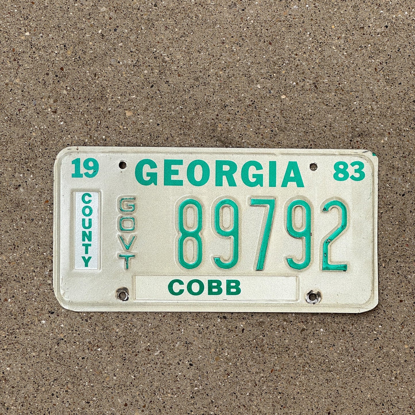 Photo of a 1983 Georgia County Government License Plate Auto Tag Garage Decor Vintage Cobb County 89792
