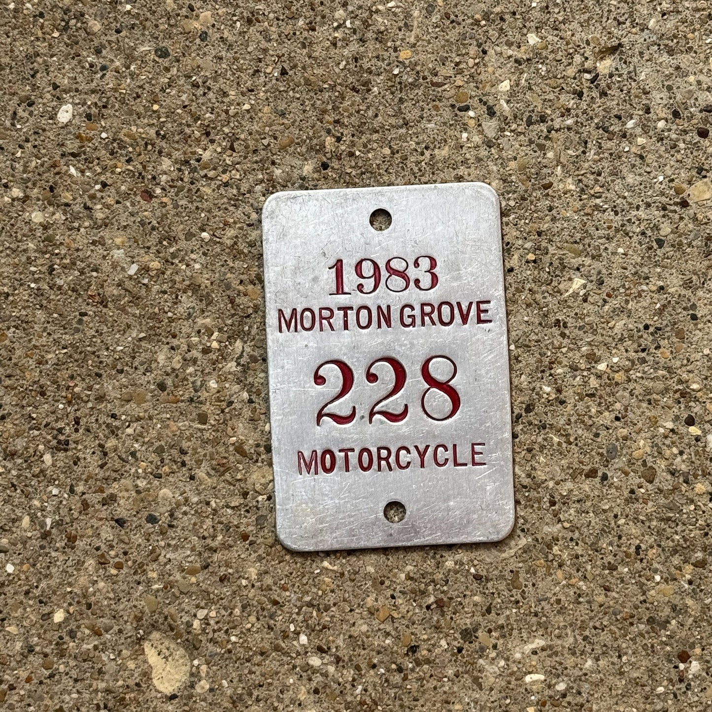 Photo of a 1983 Illinois Motorcycle Tax Tag Auto Tag Garage Decor Vintage Morton Grove 228