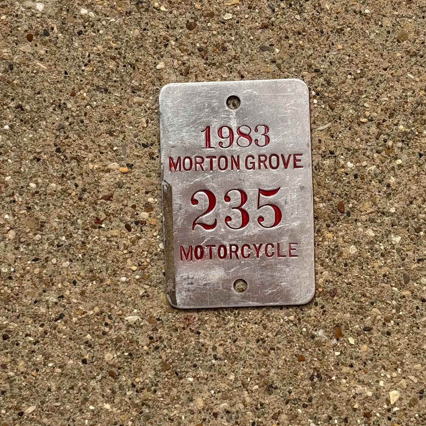 Photo of a 1983 Illinois Motorcycle Tax Tag Auto Tag Garage Decor Vintage Morton Grove 235