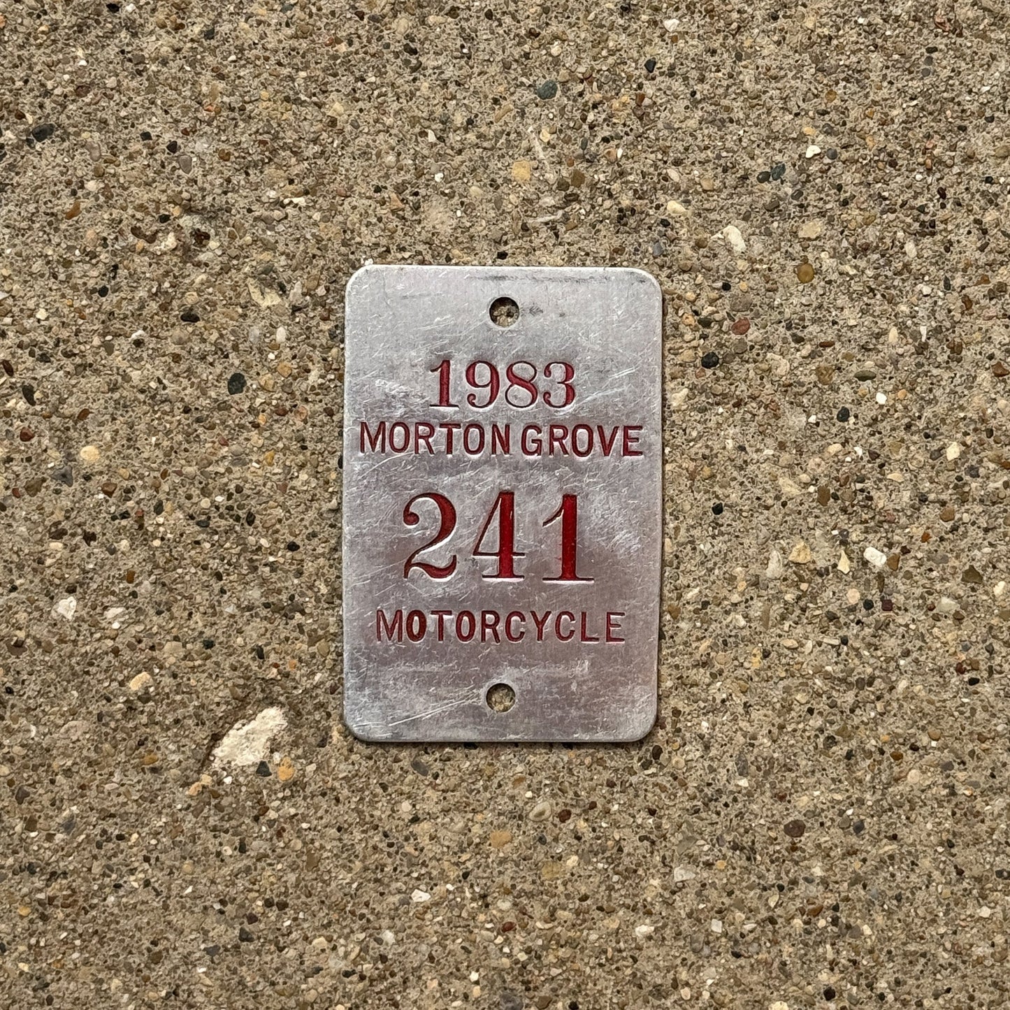 Photo of a 1983 Illinois Motorcycle Tax Tag Auto Tag Garage Decor Vintage Morton Grove 241