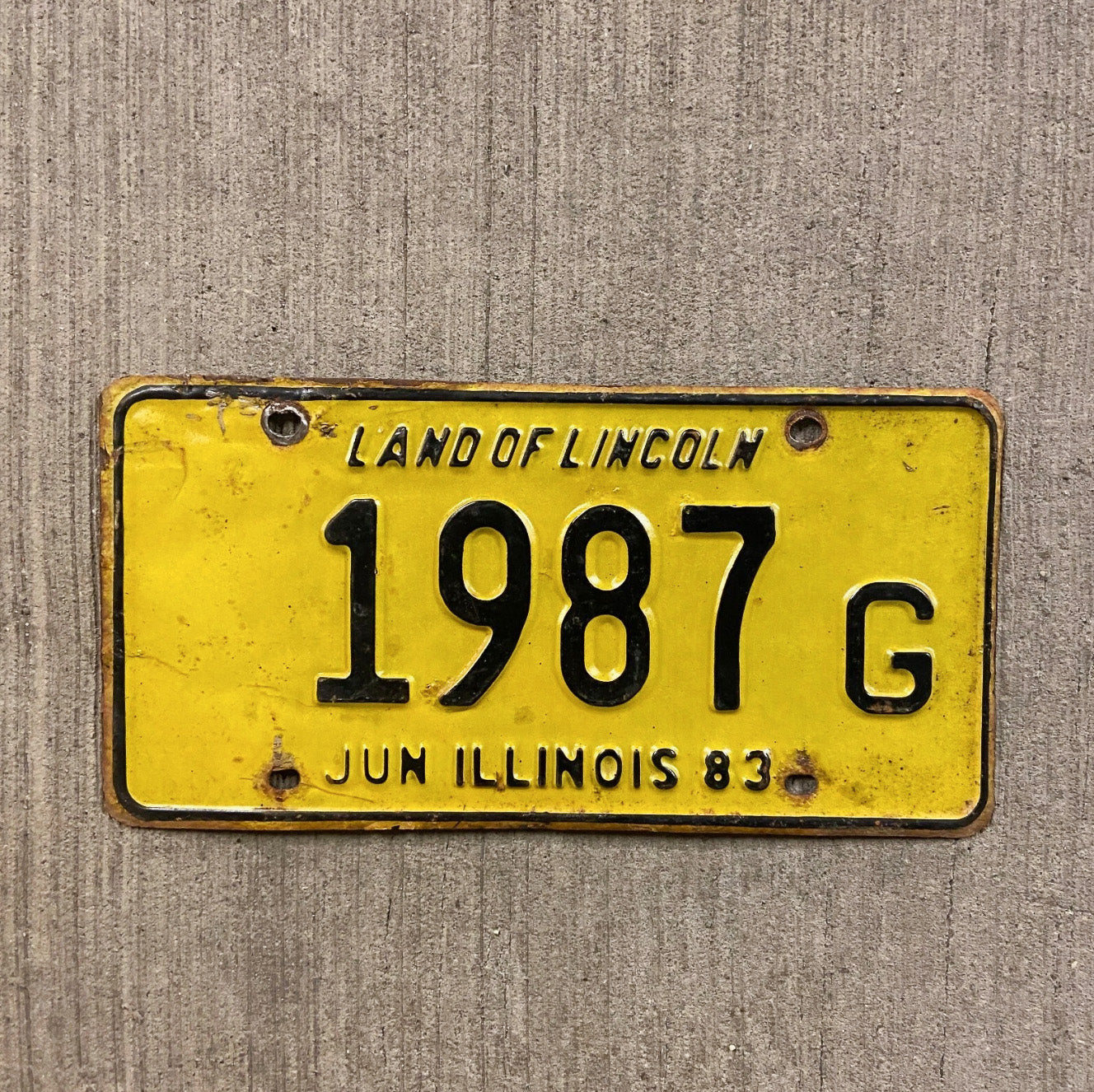 Photo of a 1983 Illinois Truck License Plate Auto Tag 2 Vintage Garage Birth Year 1987 G with original patina