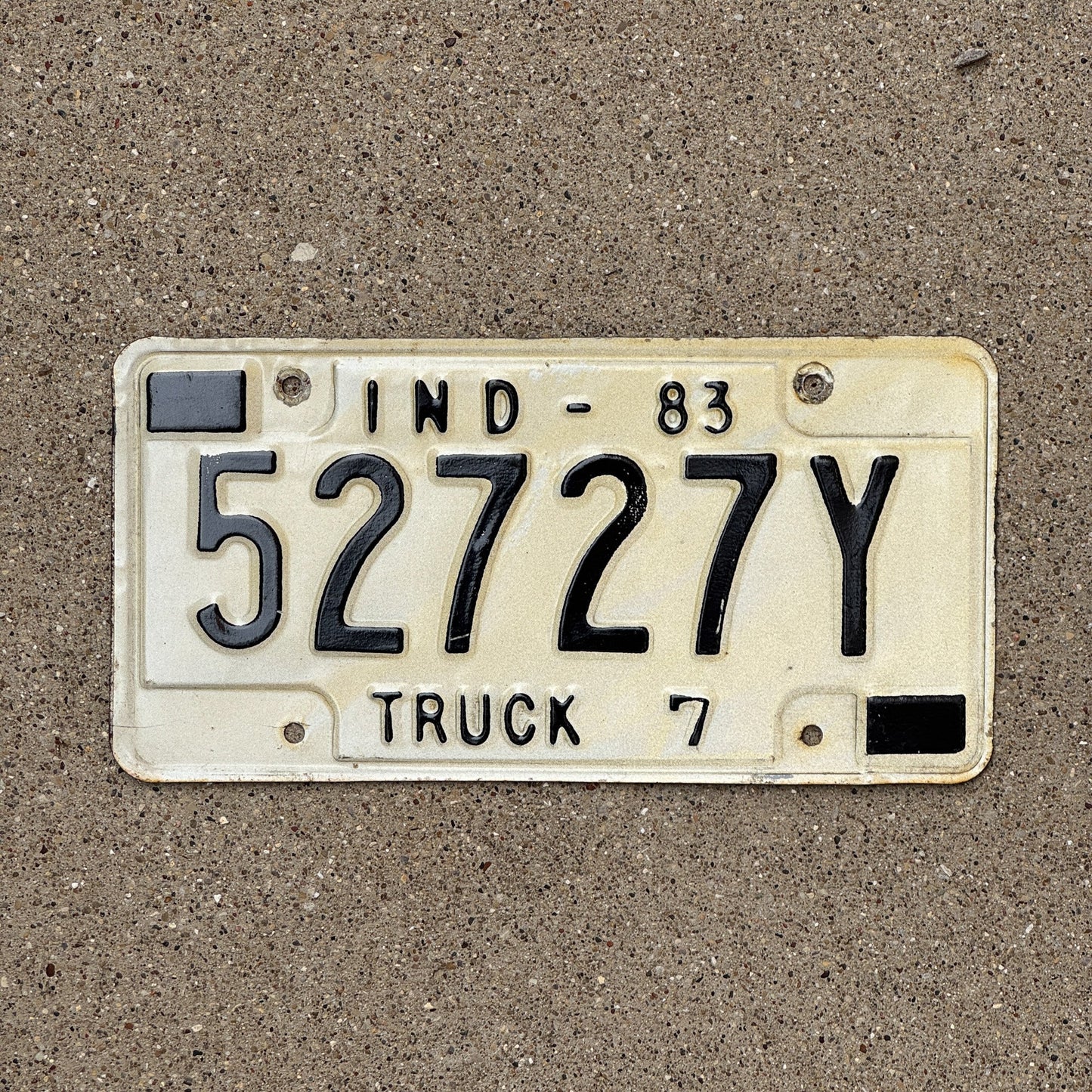Photo of a 1983 Indiana Truck License Plate Auto Tag Garage Decor Vintage 52727 Y