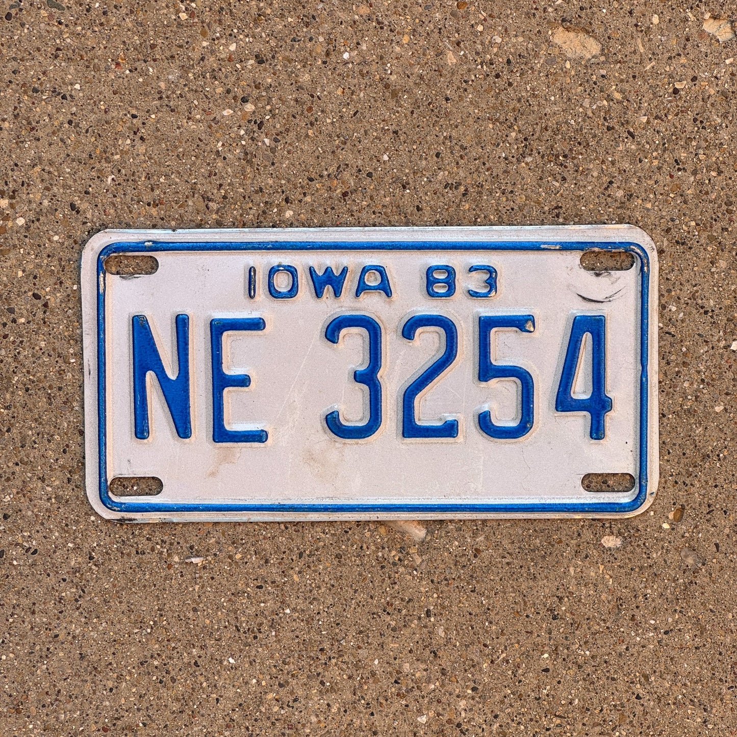 Photo of a 1983 Iowa Motorcycle License Plate Auto Tag Garage Decor Vintage NE 3254