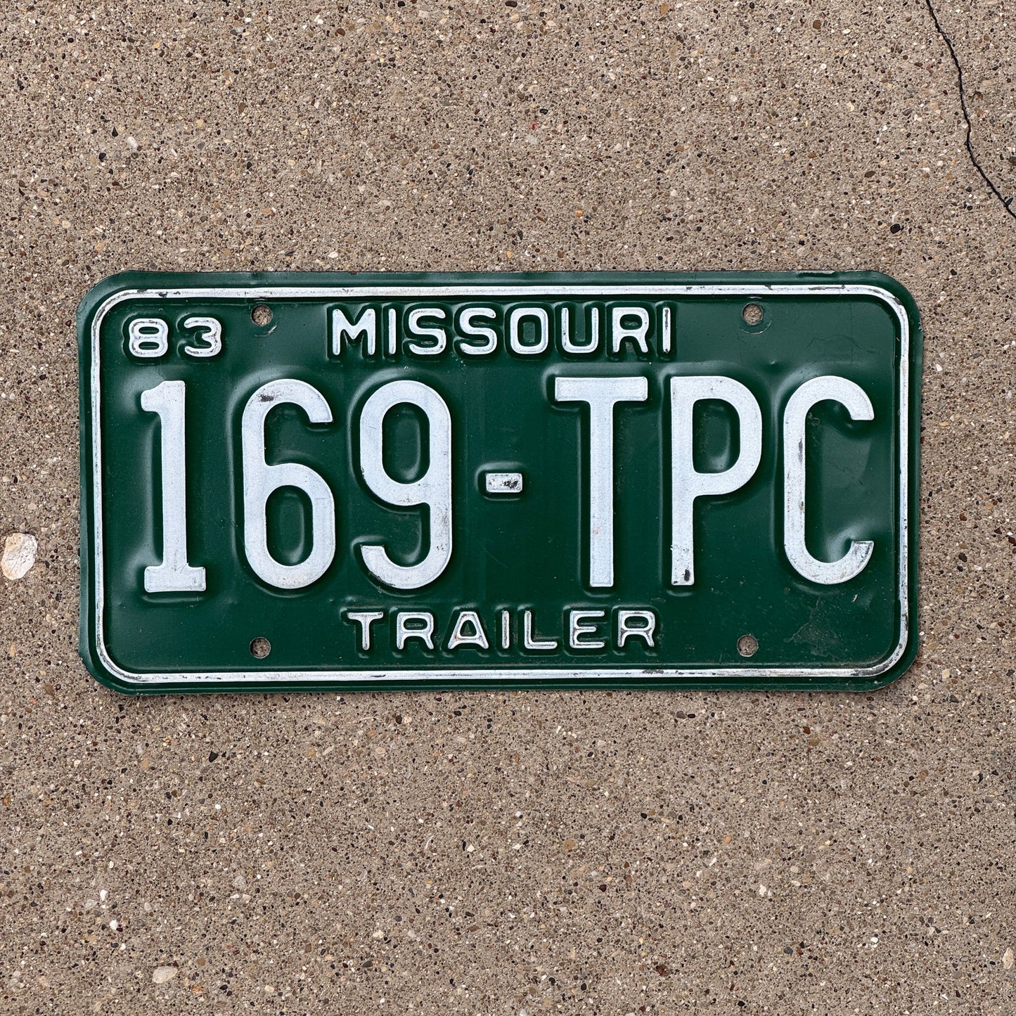 Photo of a 1983 Missouri Trailer License Plate Auto Tag Garage Decor Vintage 169 TPC