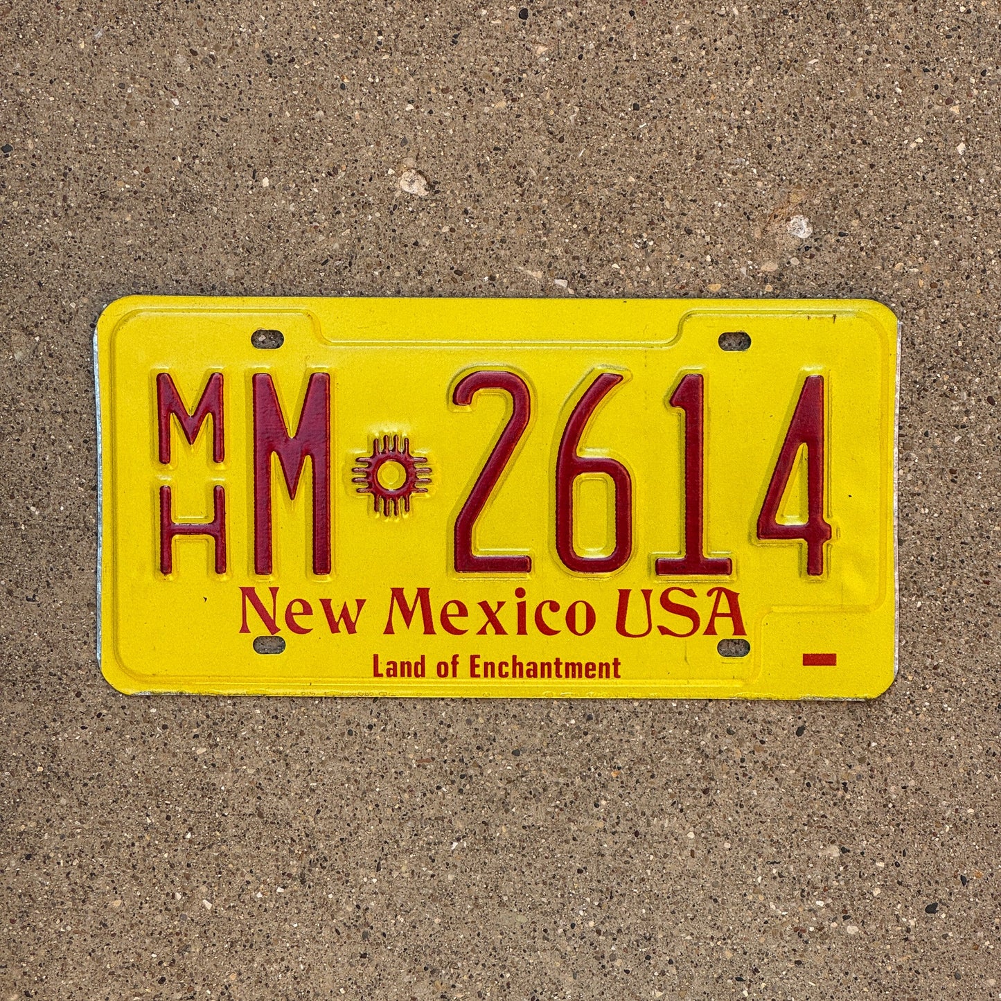 Photo of a 1983 New Mexico Mobile Home License Plate Auto Tag Garage Decor Vintage Zia MH M 2614