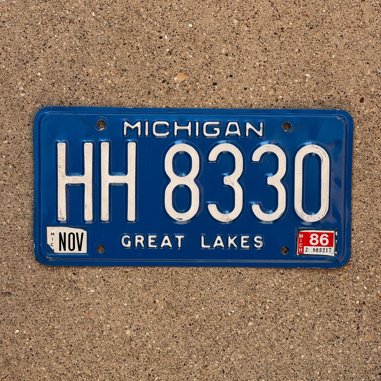 Photo of a 1984 1986 Michigan License Plate Auto Tag Garage Decor Vintage HH 8330