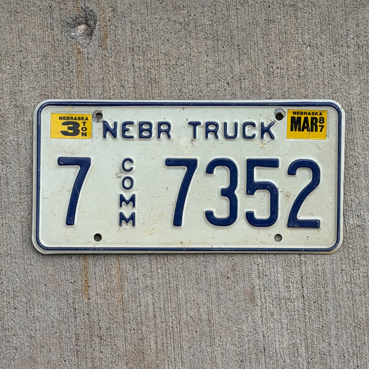 Photo of a 1984 1987 Nebraska Commercial License Plate Auto Tag Garage Decor Vintage 7 7352+K620 with original patina