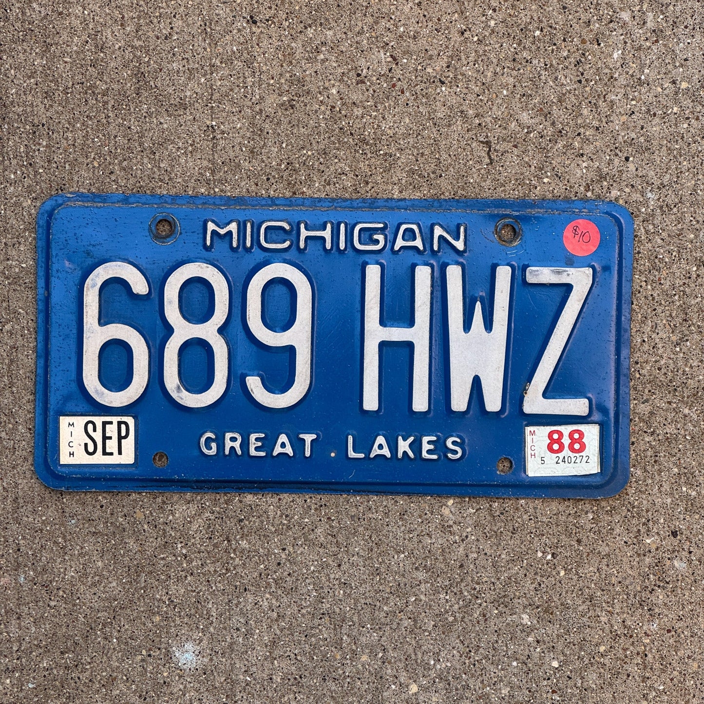 Photo of a 1984 1988 Michigan License Plate Auto Tag Garage Decor Vintage 689 HWZ with original patina