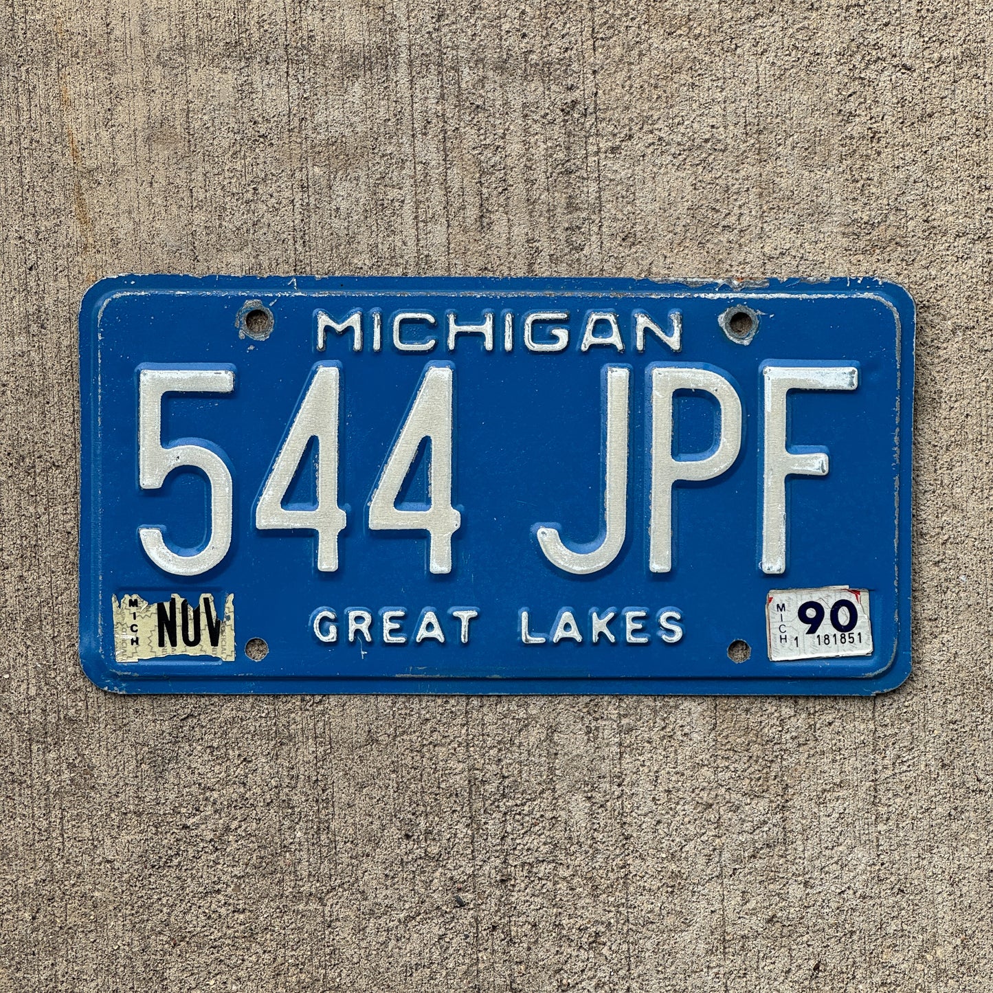 Photo of a 1984 1990 Michigan License Plate Auto Tag Garage Decor Vintage 544 JPF with original patina