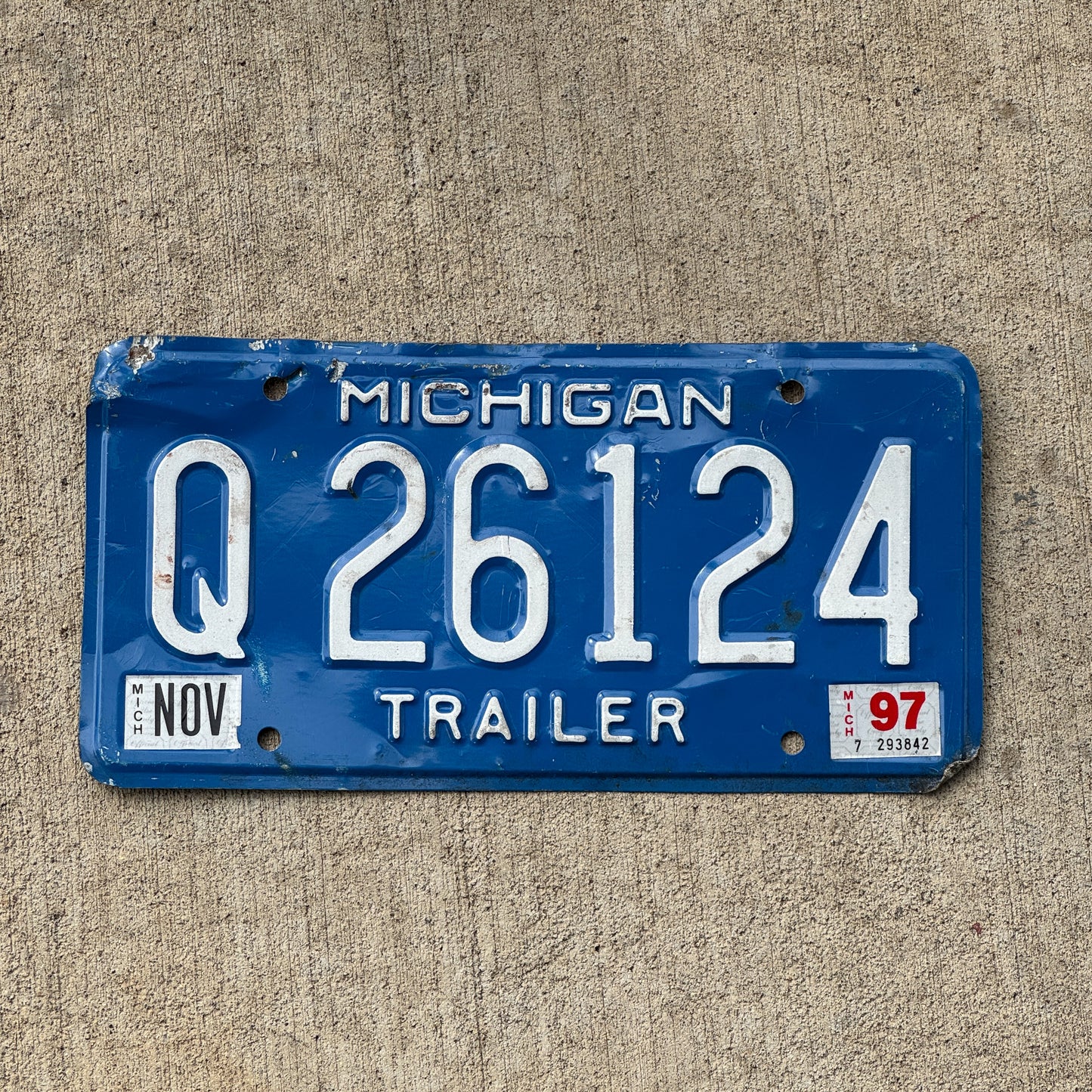 Photo of a 1984 1997 Michigan Trailer License Plate Auto Tag Garage Decor Vintage Q 26124 with original patina