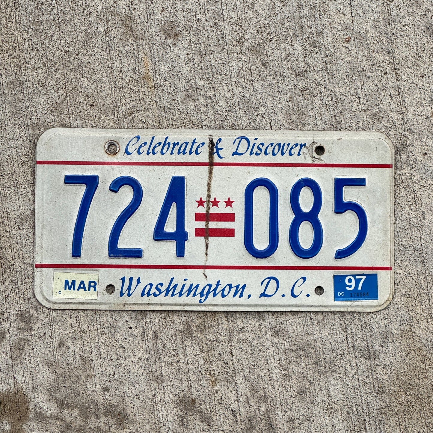 Photo of a 1984 1997 Washington DC License Plate Auto Tag Garage Decor Vintage Celebrate and Discover 724 085 with original patina