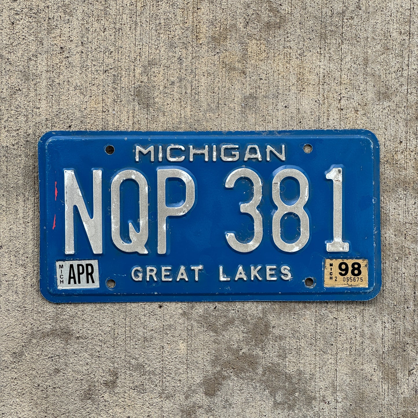 Photo of a 1984 1998 Michigan License Plate Auto Tag Garage Decor Vintage NQP 381 with original patina