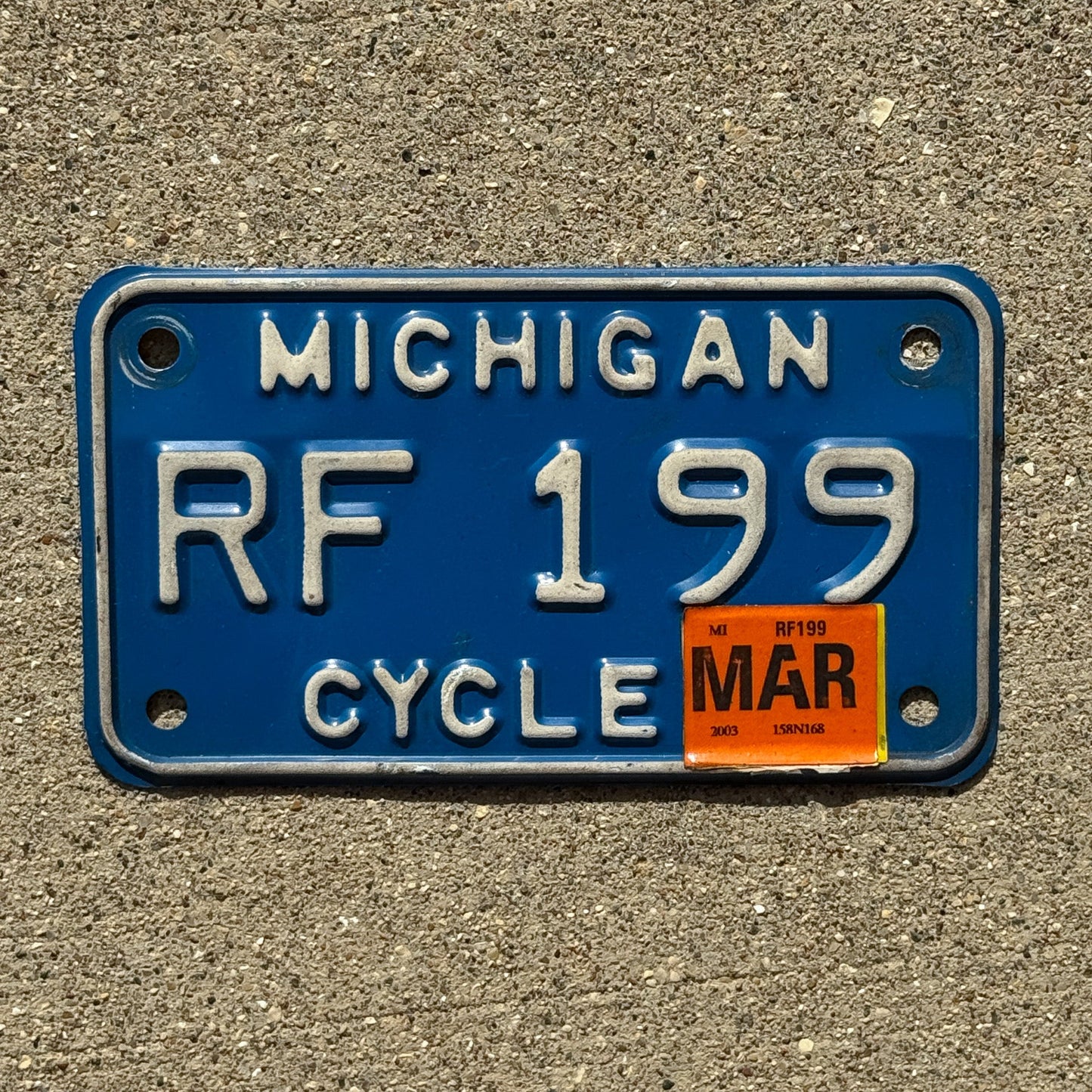 Photo of a 1984 2003 Michigan Motorcycle License Plate Auto Tag Garage Decor Vintage RF 199