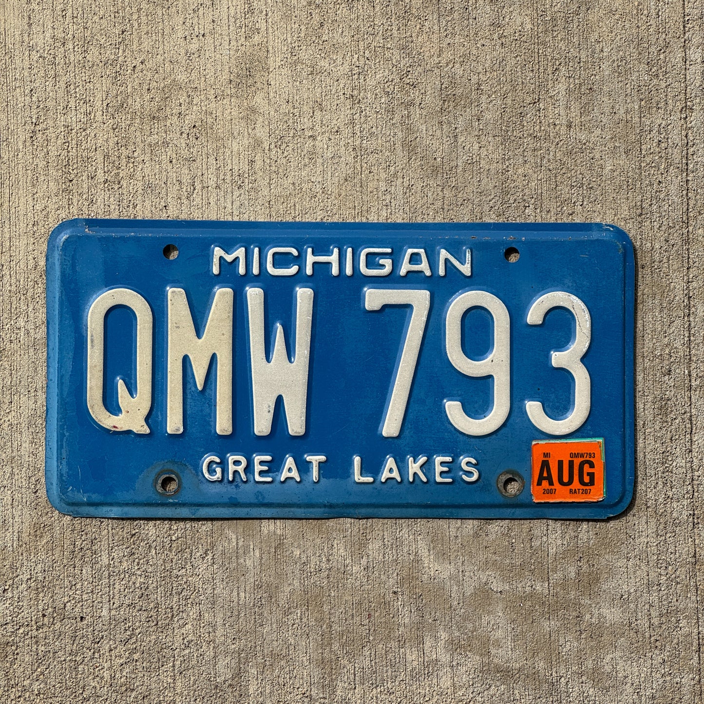 Photo of a 1984 2007 Michigan License Plate Auto Tag Garage Decor Vintage QMW 793 with original patina