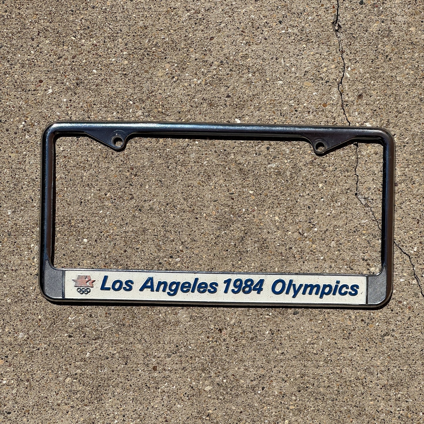 Photo of a 1984 California License Plate Frame Auto Tag Garage Decor Vintage Los Angeles 1984 Olympics