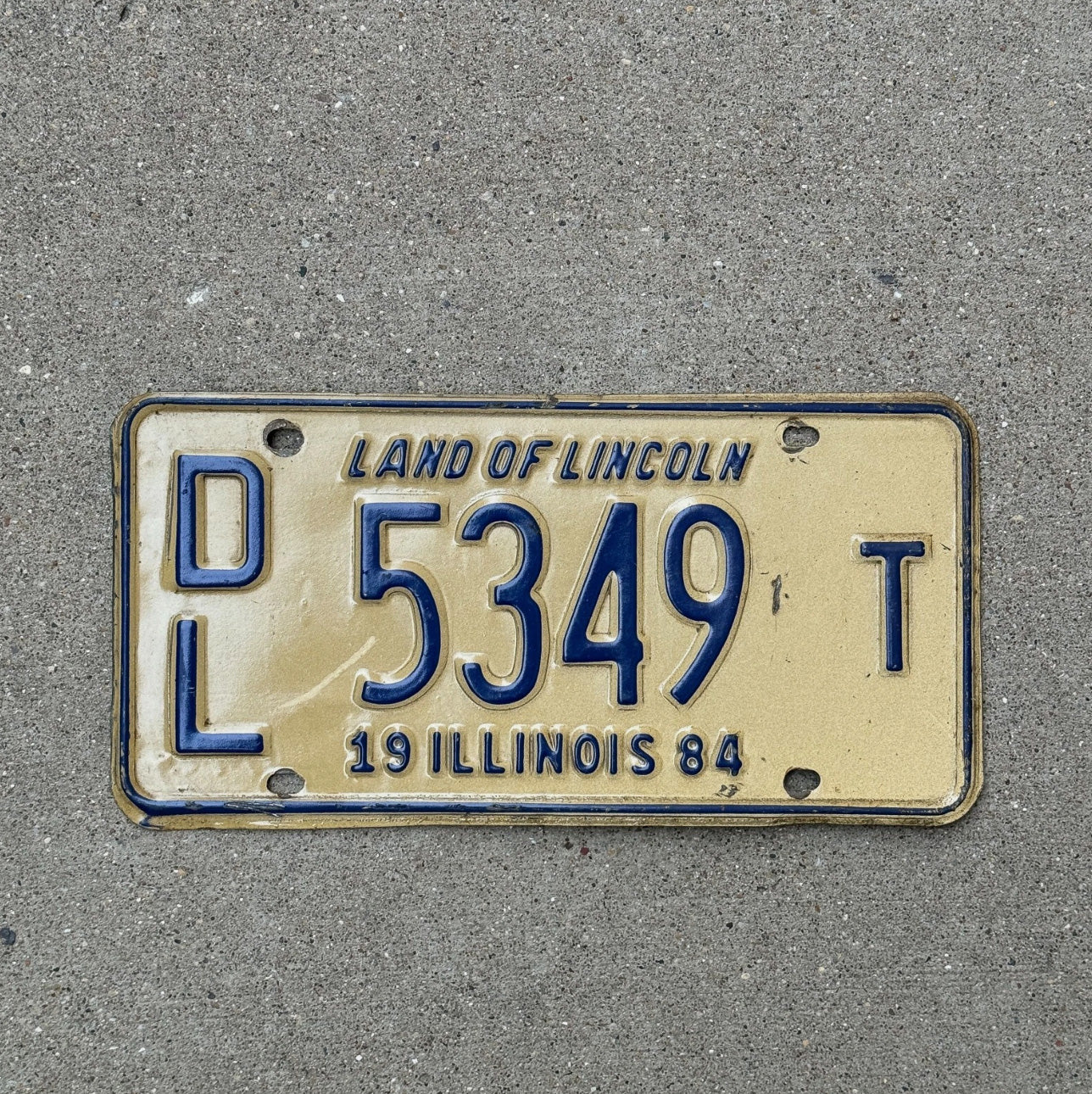 Photo of a 1984 Illinois Dealer License Plate Auto Tag Garage Decor Vintage 5349 T
