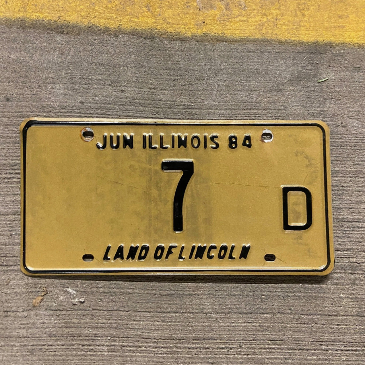 Photo of a 1984 Illinois Truck License Plate Auto Tag Garage Decor Vintage Low Number Single Digit 7 D with original patina