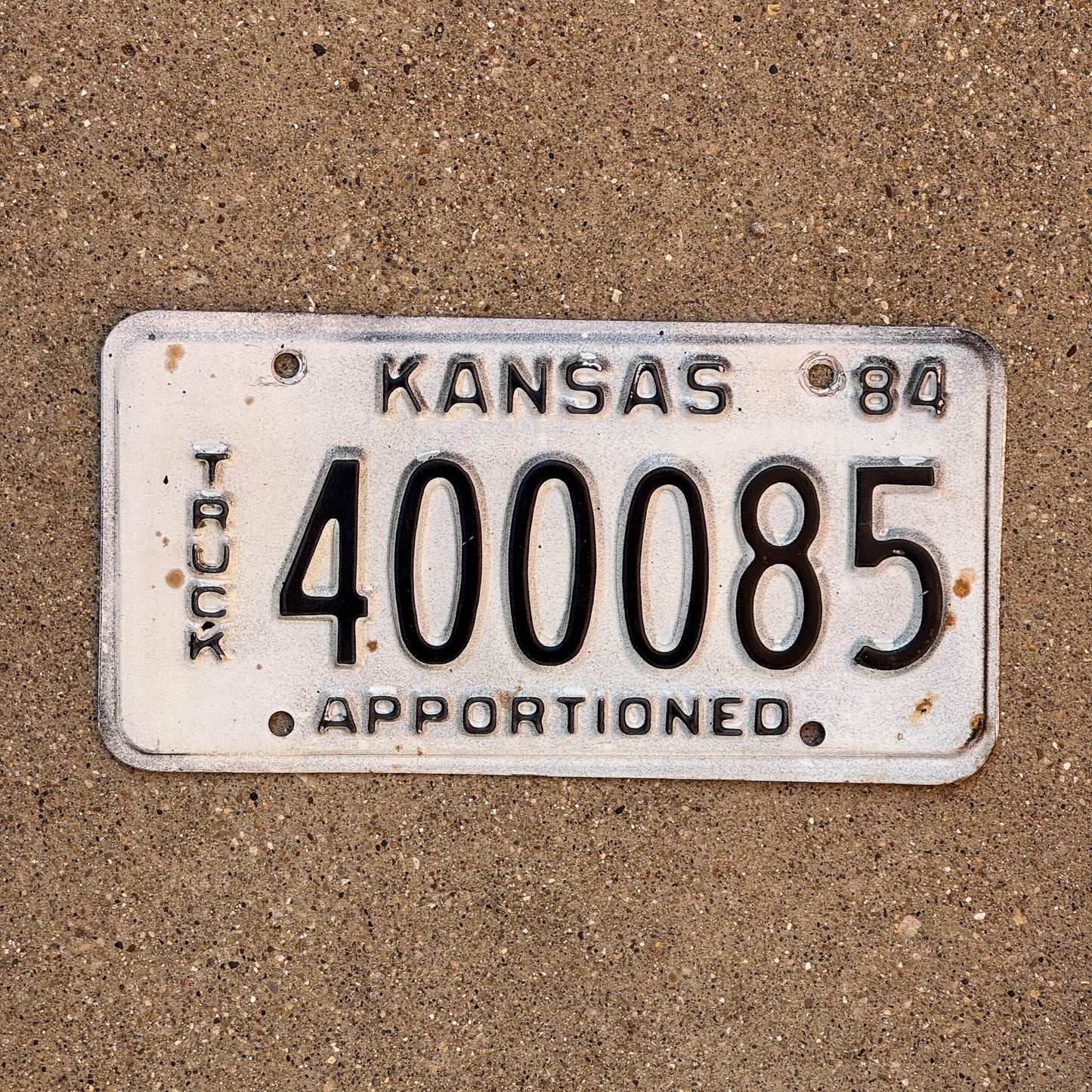 Photo of a 1984 Kansas Apportioned License Plate Auto Tag Garage Decor Vintage 400085
