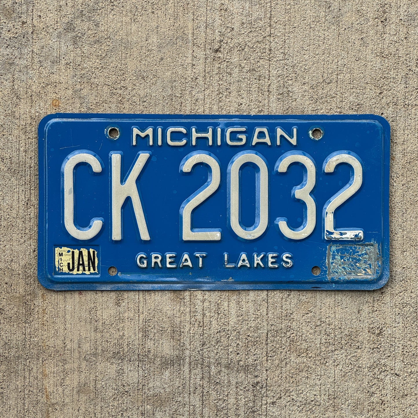 Photo of a 1984 Michigan Commercial License Plate Auto Tag Garage Decor Vintage CK 2032 with original patina