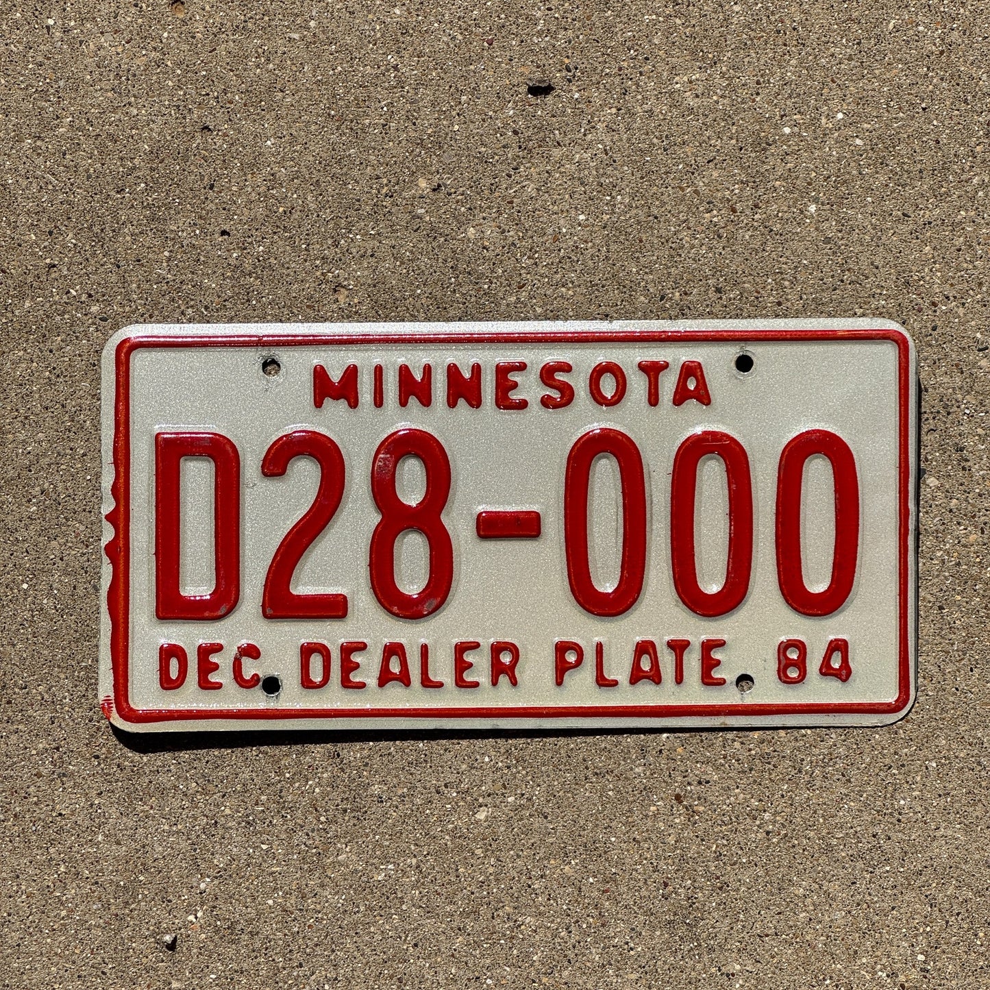 Photo of a 1984 Minnesota Dealer License Plate Auto Tag Garage Decor Vintage Repeat Repeating D 28000