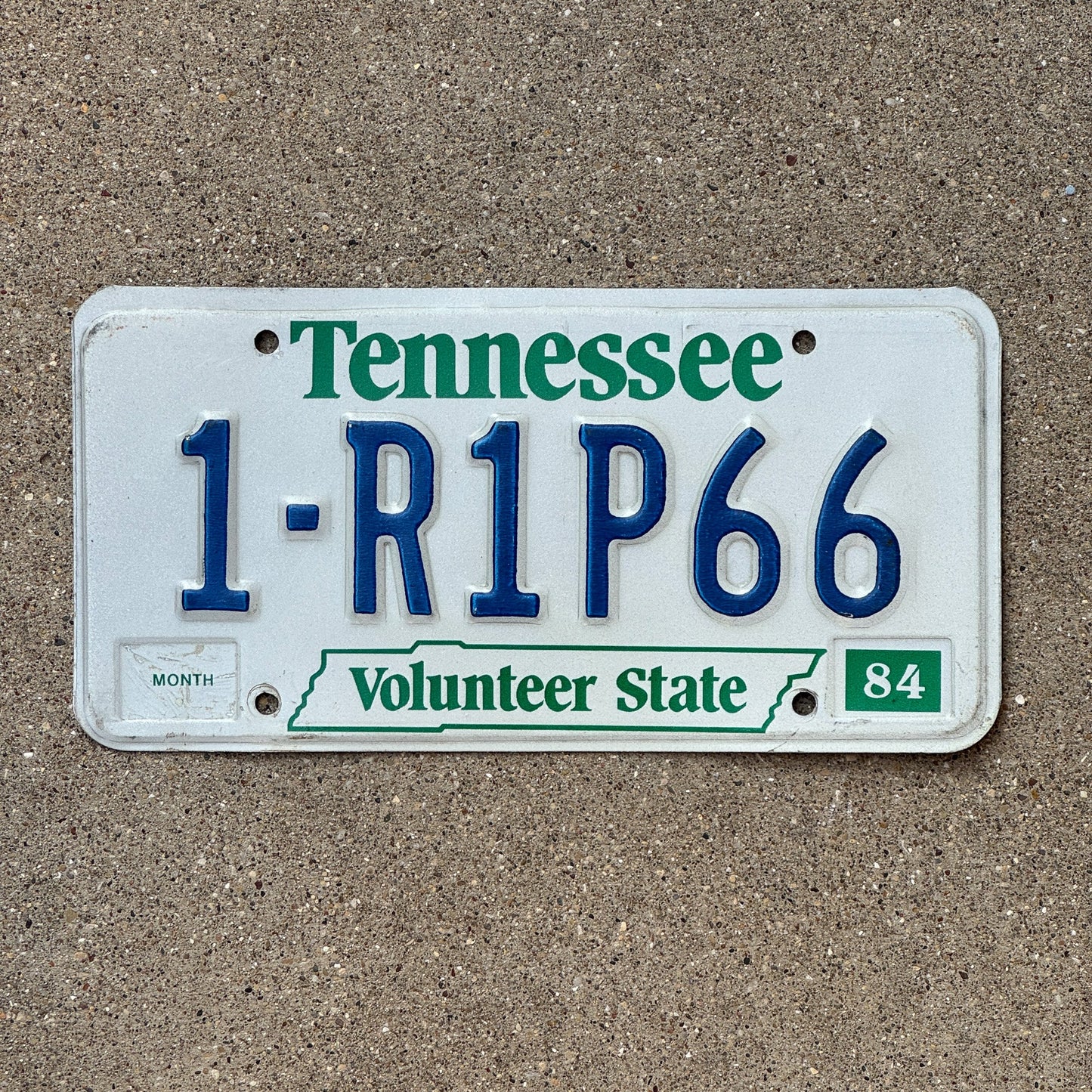 Photo of a 1984 Tennessee License Plate Auto Tag Garage Decor Vintage 1 RIP 66