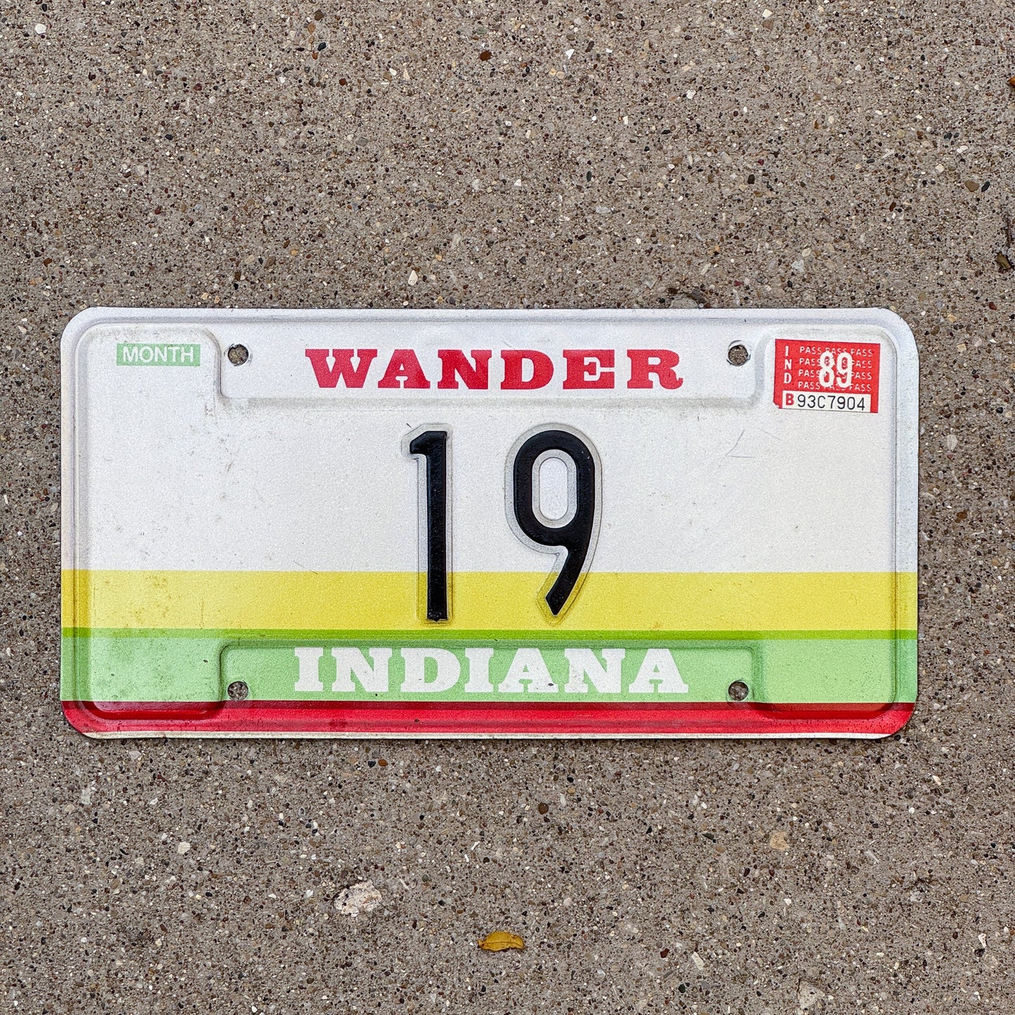 Photo of a 1985 1989 Indiana Sample License Plate Auto Tag Garage Decor Vintage 19th State 19 with original patina