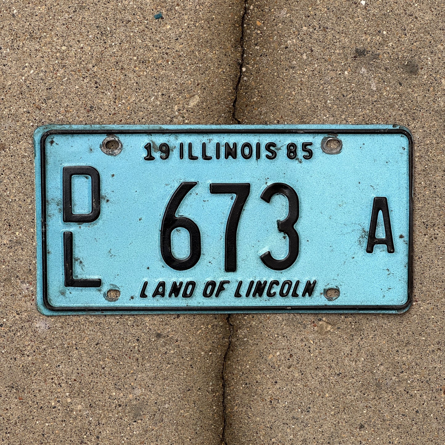 Photo of a 1985 Illinois Dealer License Plate Auto Tag 2 Vintage Garage Merritt's Sterling Ford Mercury Lincoln Dealer 673 A with original patina