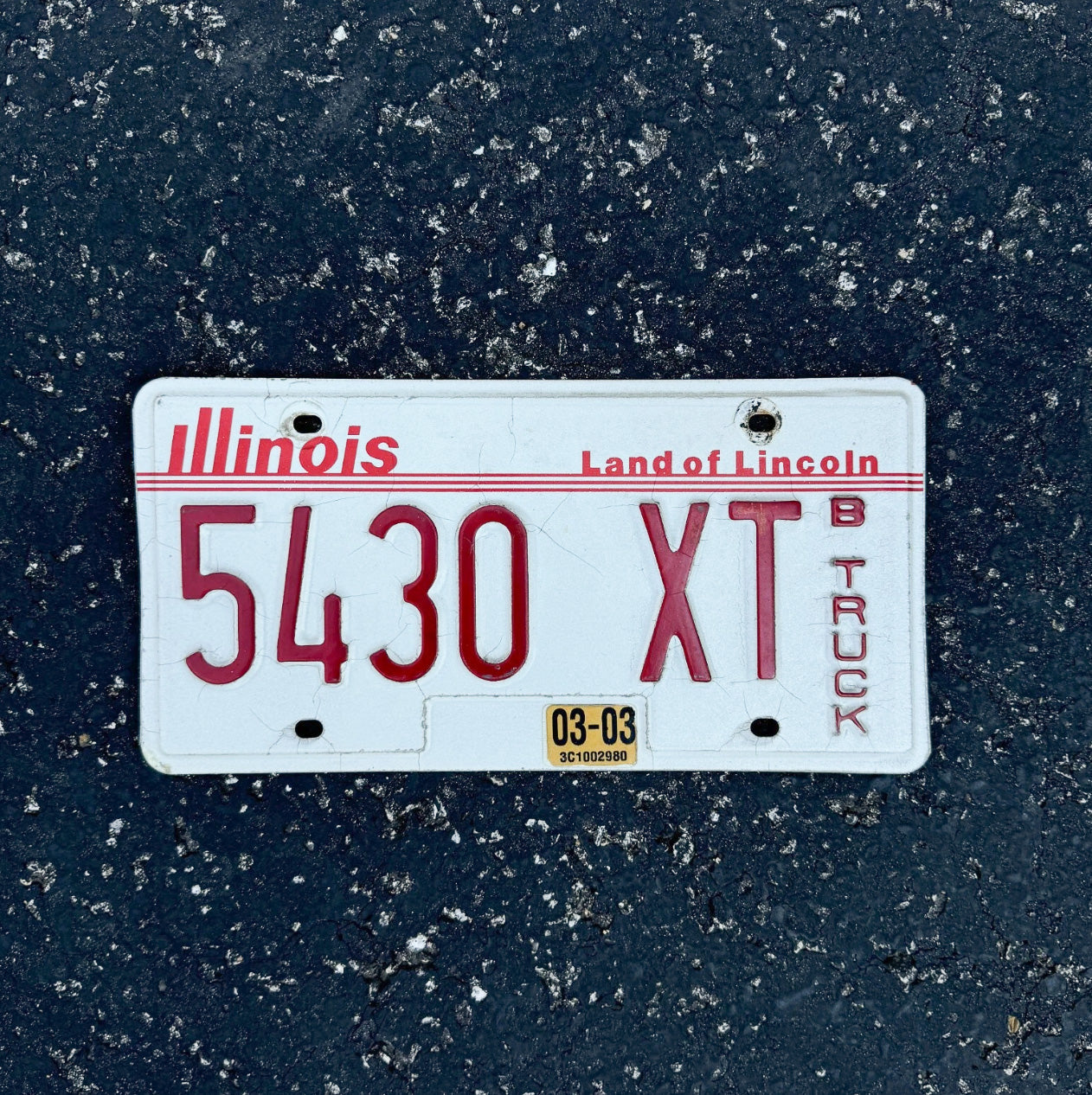Photo of a 1985 Illinois Truck License Plate Auto Tag Garage Decor Vintage 5430 XT
