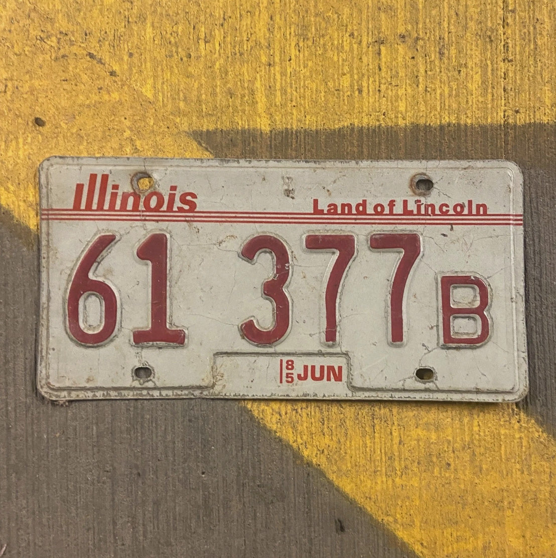 Photo of a 1985 Illinois Truck License Plate Auto Tag Garage Decor Vintage 61 377 B