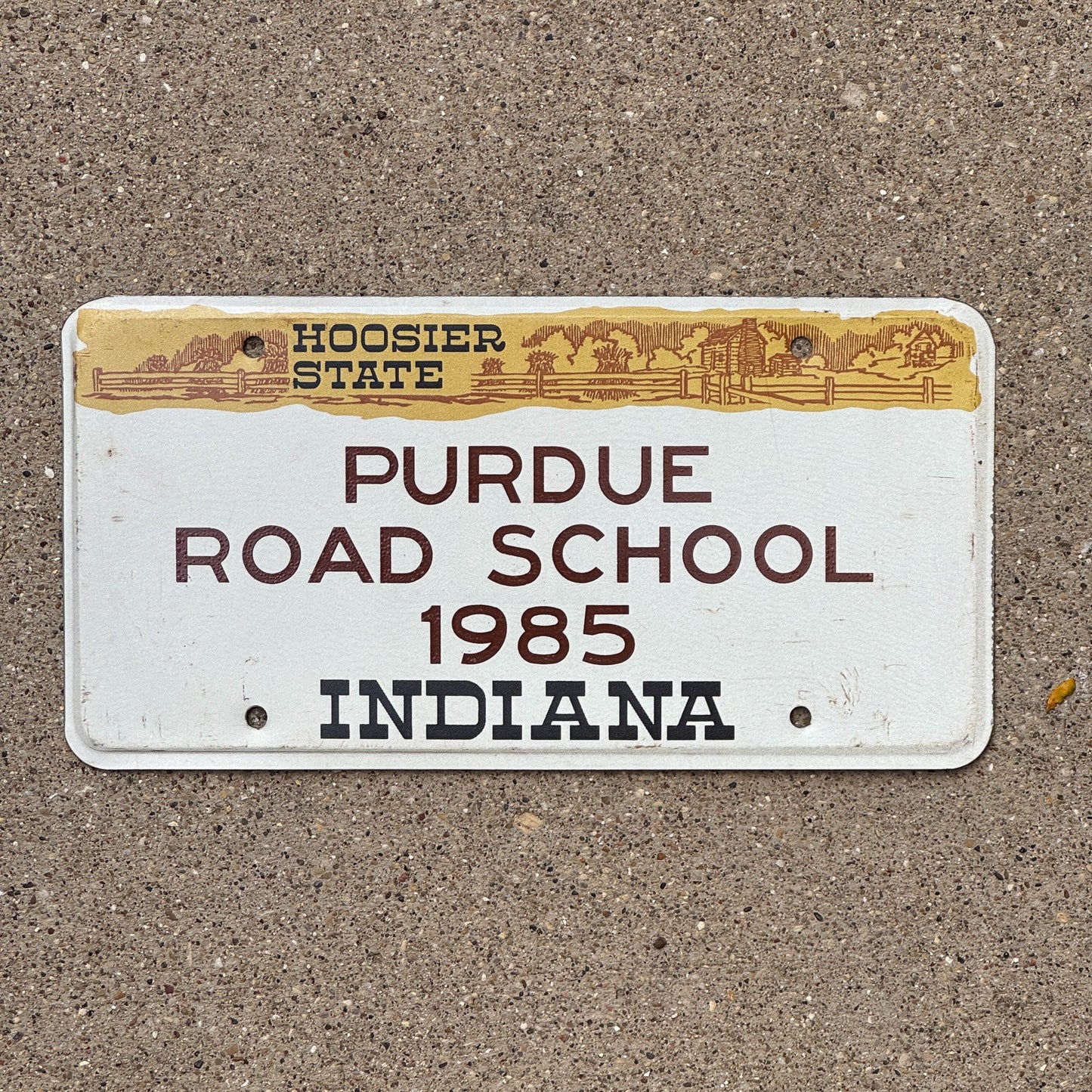 Photo of a 1985 Indiana License Plate Auto Tag Garage Decor Vintage Big Ten Purdue Road School with original patina