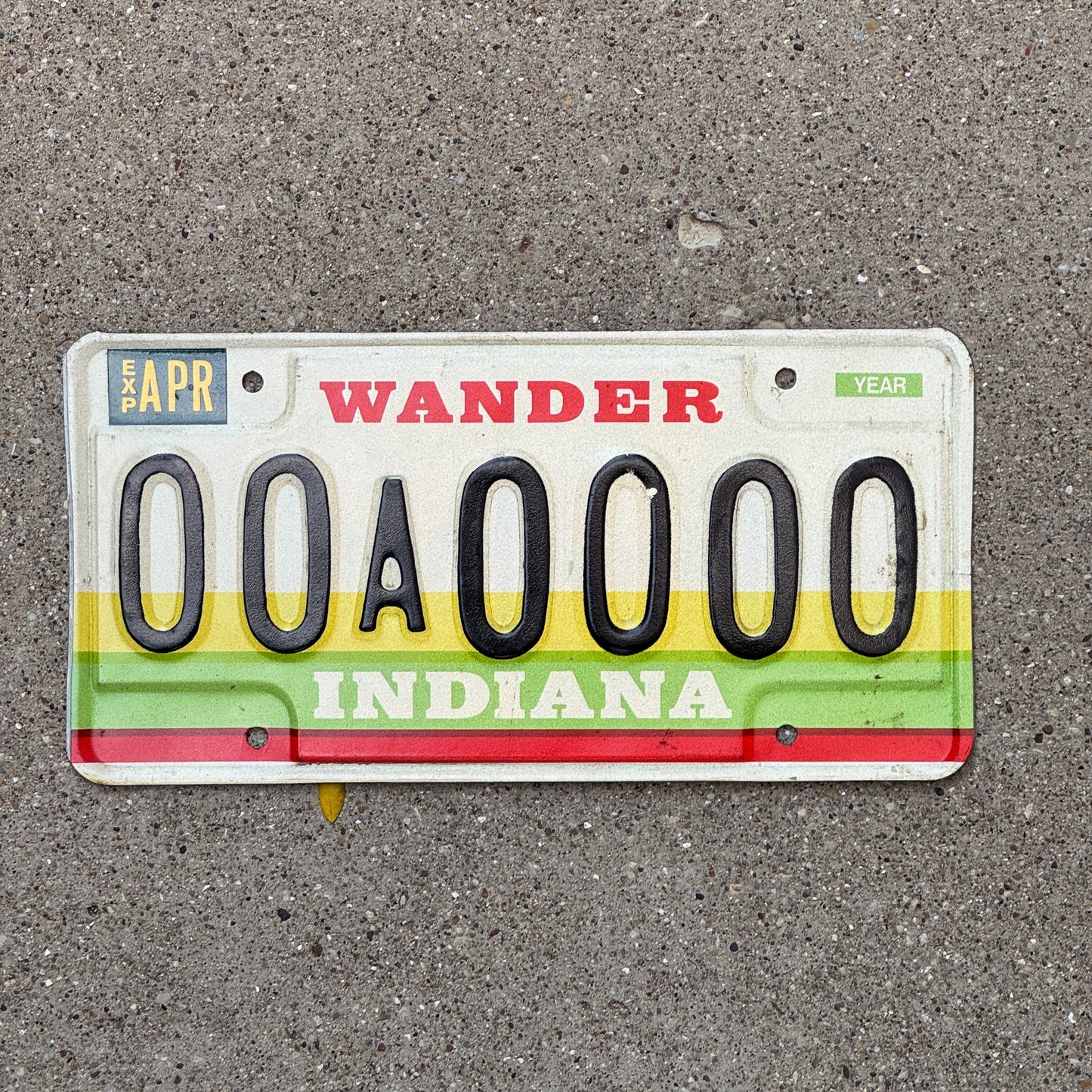 Photo of a 1985 Indiana Sample License Plate Auto Tag 3 Vintage 00A0000 with original patina