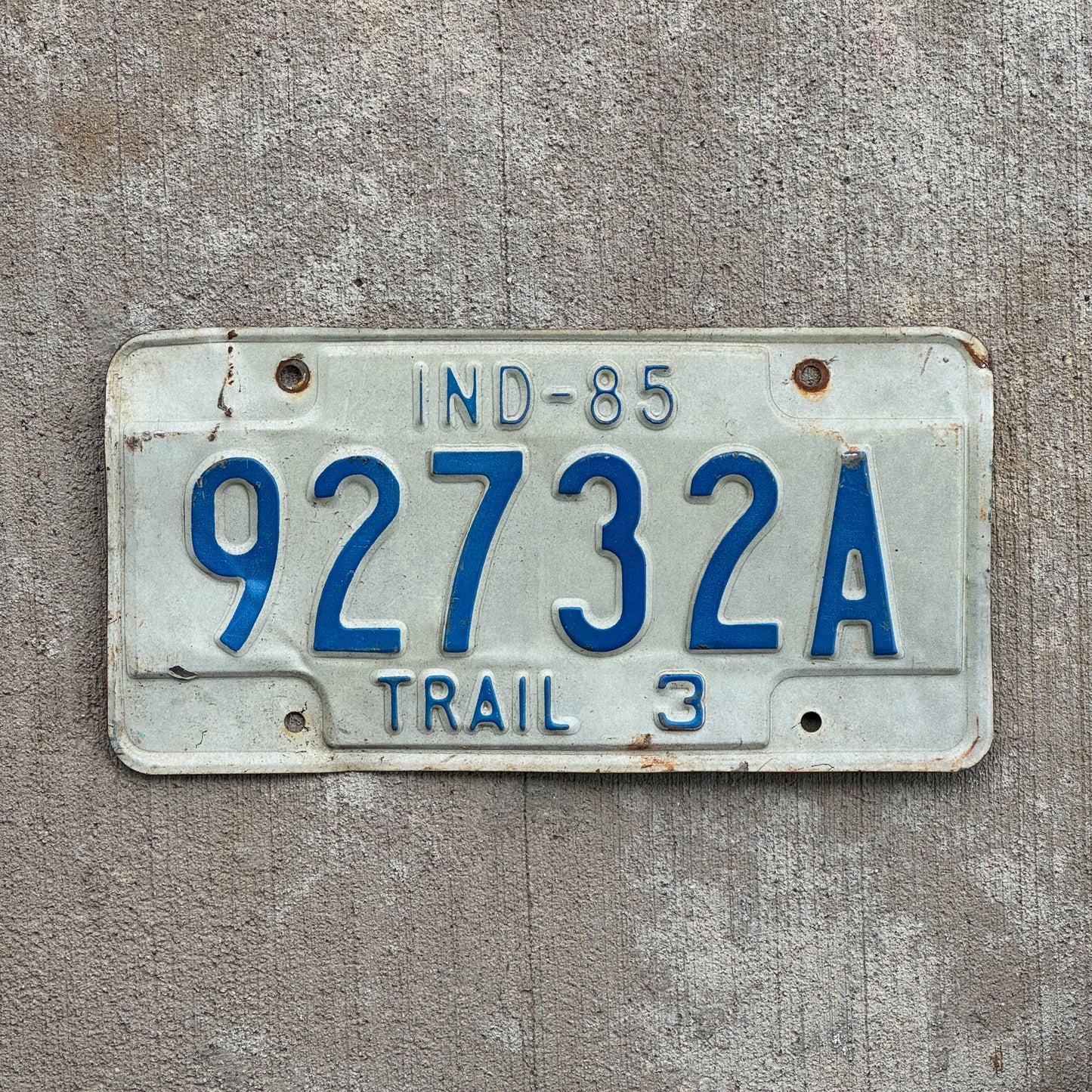 Photo of a 1985 Indiana Trailer License Plate Auto Tag Garage Decor Vintage 92732 A with original patina