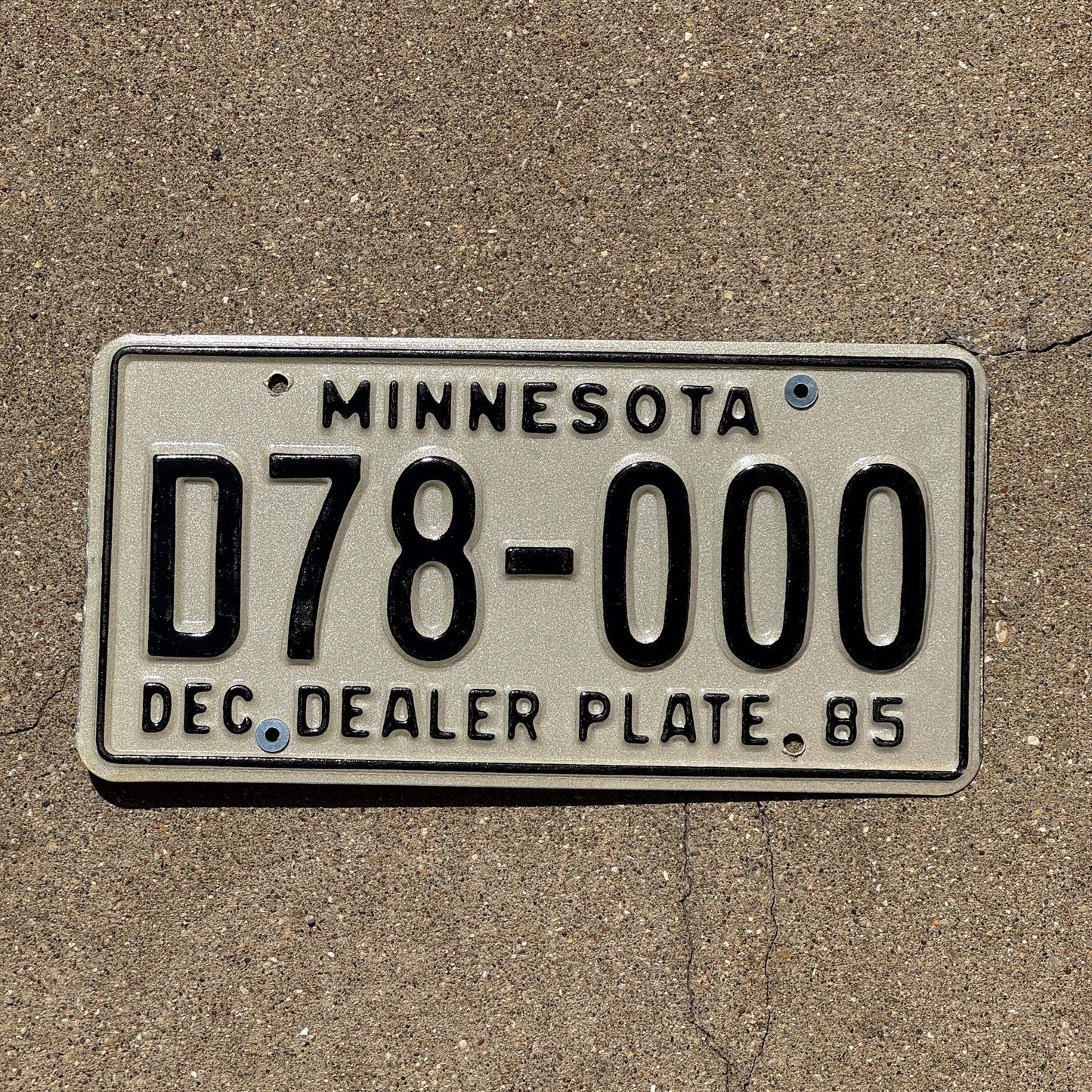 Photo of a 1985 Minnesota Dealer License Plate Auto Tag Garage Decor Vintage Repeat Repeating D 78000