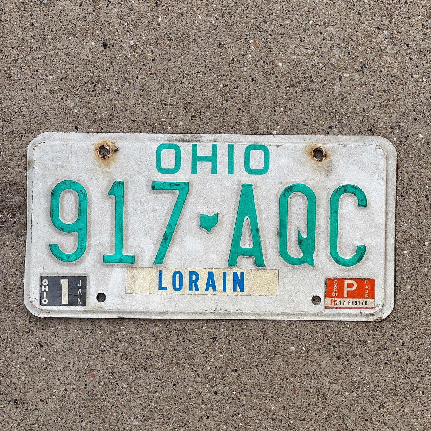 Photo of a 1985 Ohio License Plate Auto Tag 1 Vintage Garage 917 AQC with original patina