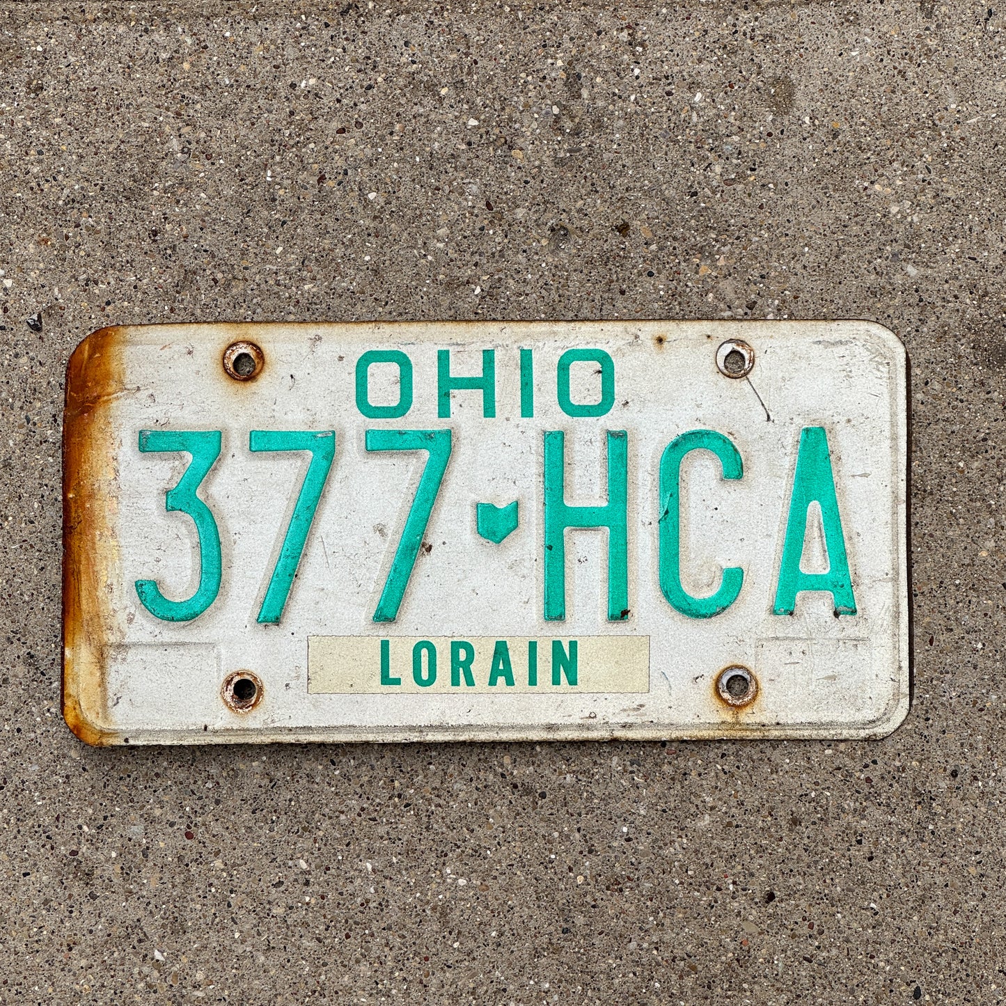 Photo of a 1985 Ohio License Plate Auto Tag 2 Vintage Garage 377 HCA with original patina