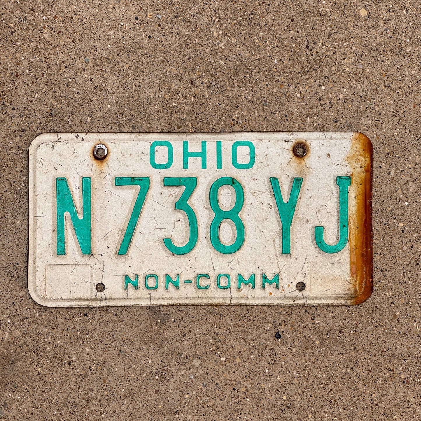 Photo of a 1985 Ohio Truck License Plate Auto Tag 2 Vintage Garage Non Commercial N 738 YJ with original patina