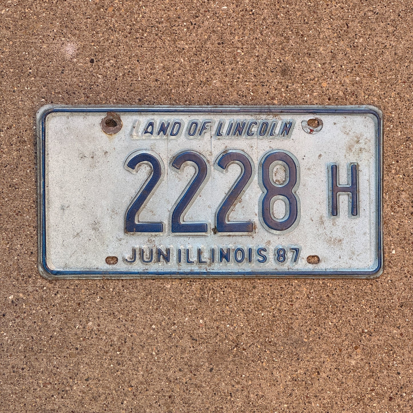 Photo of a 1986 1987 Illinois Truck License Plate Auto Tag 1 Vintage Garage Repeat Repeating 2228 H with original patina