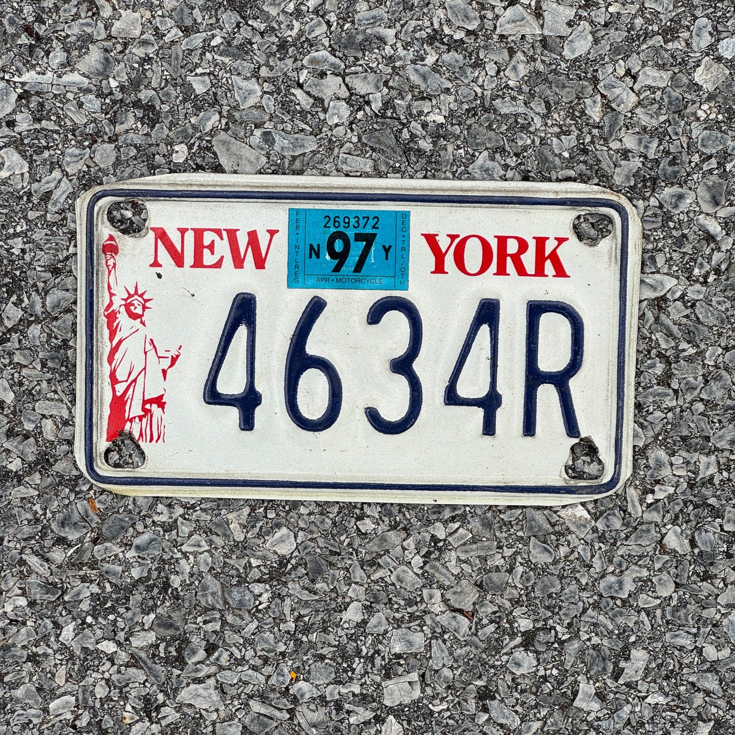 Photo of a 1986 1997 New York Motorcycle License Plate Auto Tag Garage Decor Vintage Liberty Base 4634R