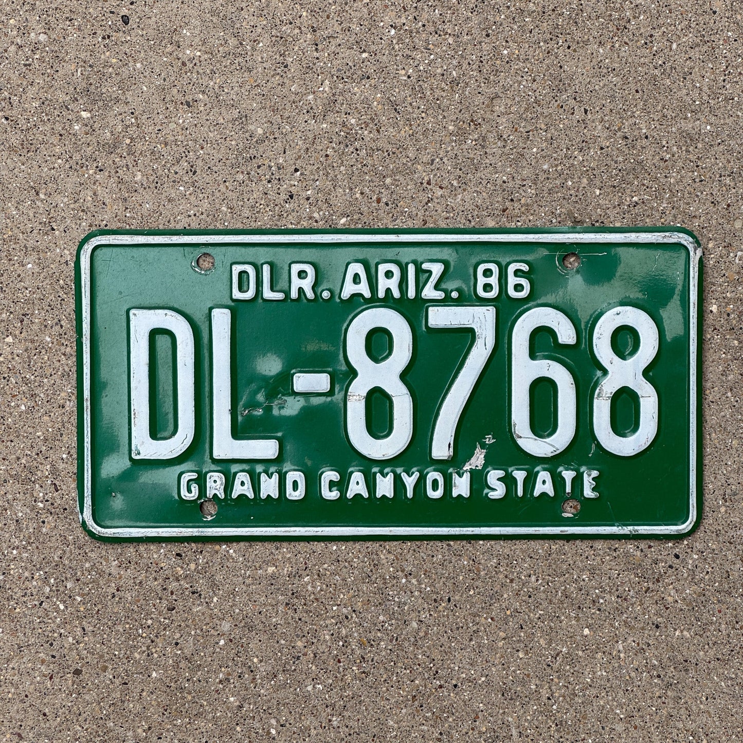 Photo of a 1986 Arizona Dealer License Plate Auto Tag Garage Decor Vintage DL 8768