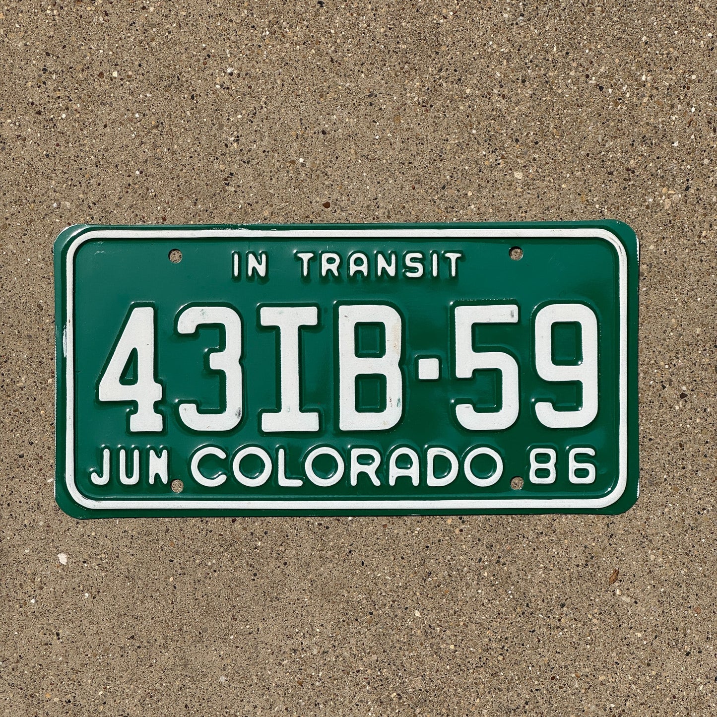 Photo of a 1986 Colorado In Transit License Plate Auto Tag Garage Decor Vintage 43 IB 59