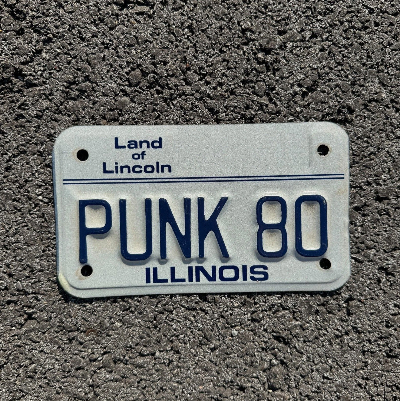 Photo of a 1986 Illinois Motorcycle License Plate Auto Tag Garage Decor Vintage Bike Rock Goth Music PUNK 80