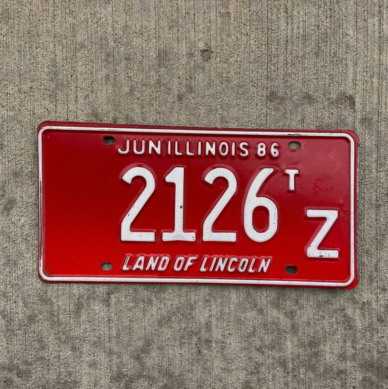 Photo of a 1986 Illinois Truck Tractor License Plate Auto Tag Garage Decor Vintage 2126 TZ with original patina