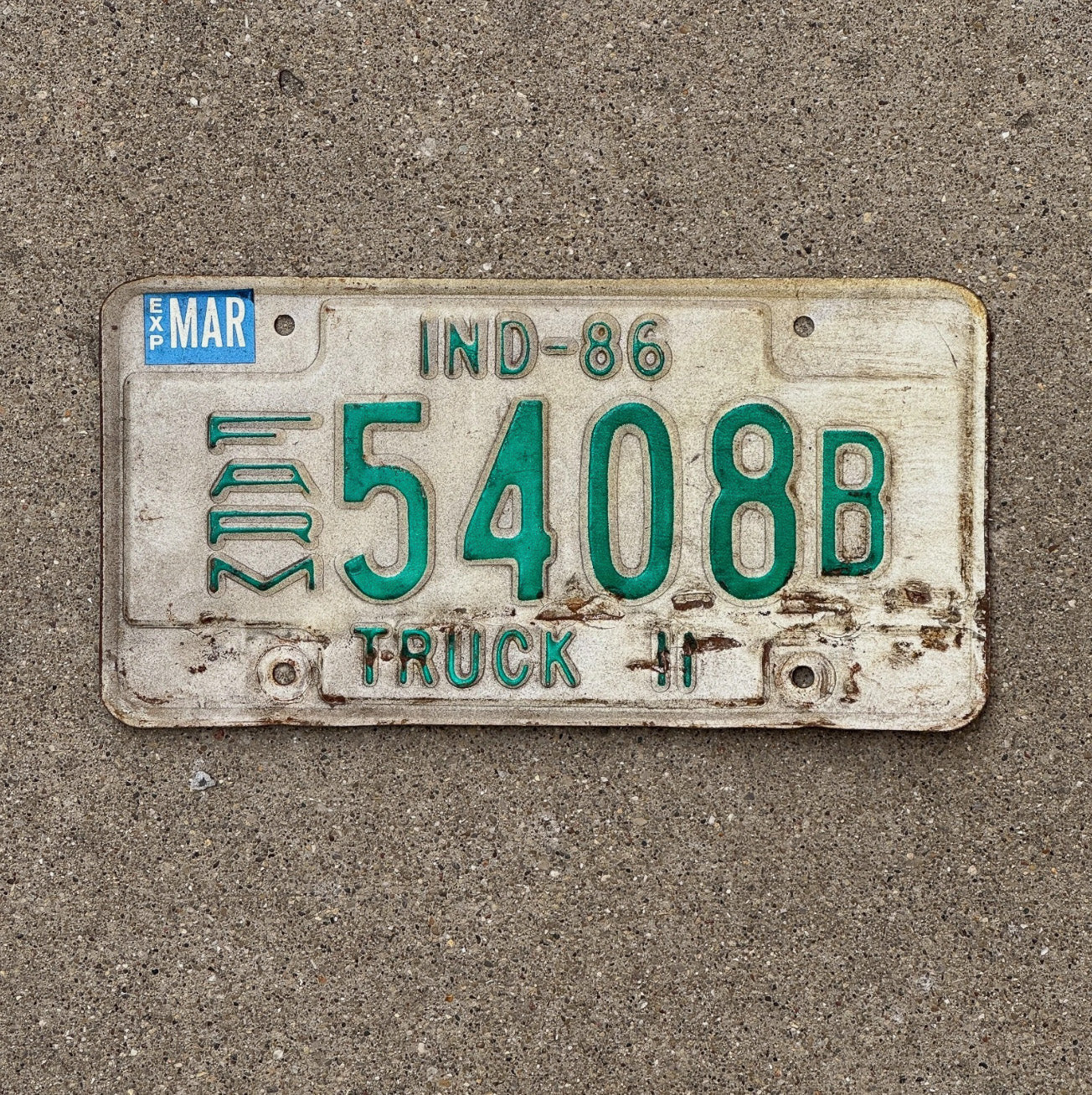 Photo of a 1986 Indiana Farm Truck License Plate Auto Tag Garage Decor 5408 B