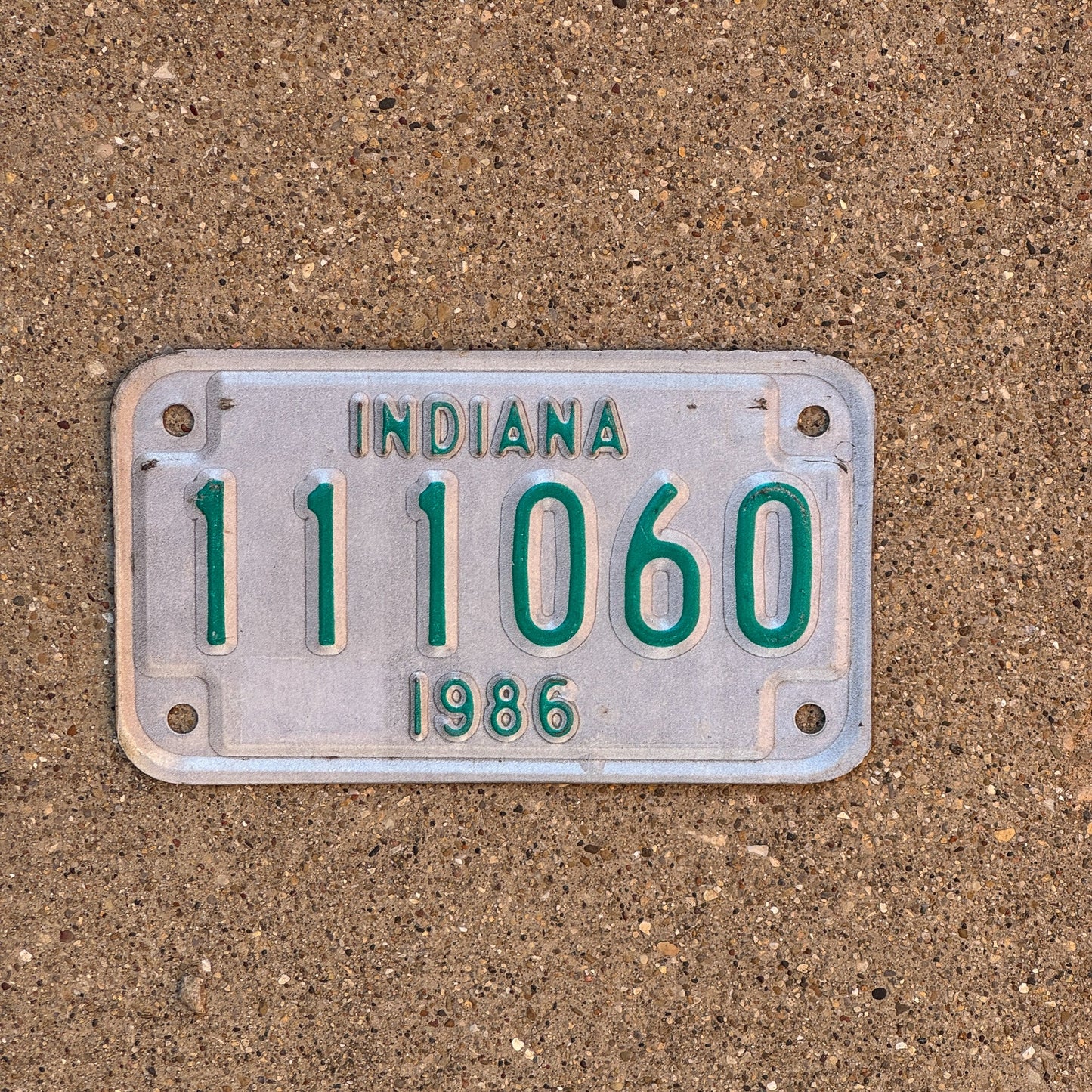 Photo of a 1986 Indiana Motorcycle License Plate Auto Tag Garage Decor Vintage 111 Repeat Repeating 111060