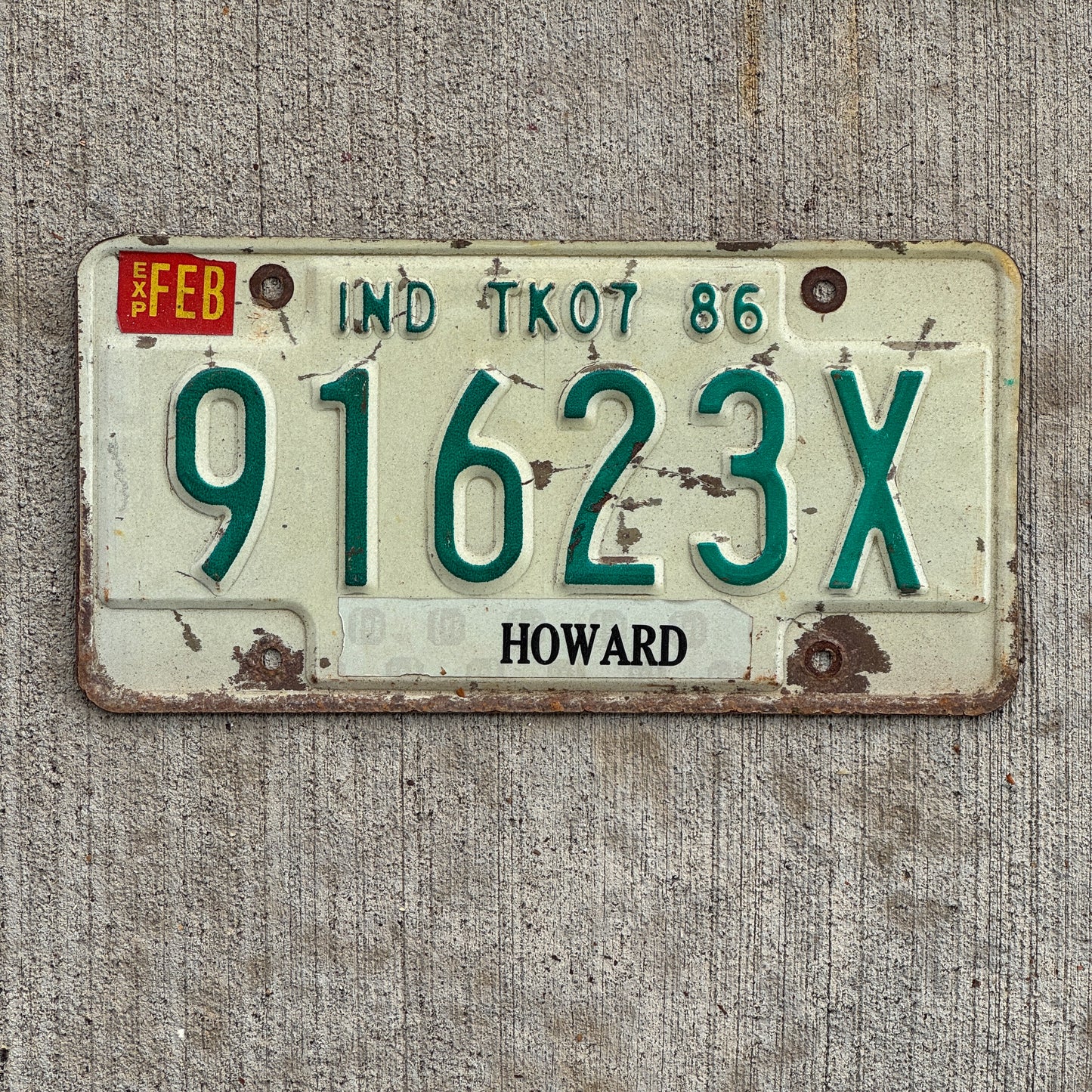 Photo of a 1986 Indiana Truck License Plate Auto Tag Garage Decor Vintage 91623 X with original patina