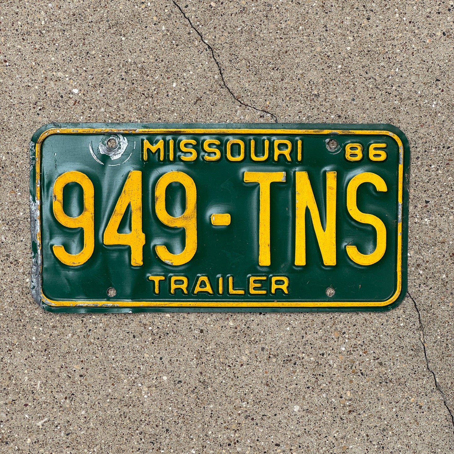 Photo of a 1986 Missouri Trailer License Plate Auto Tag Garage Decor Vintage 949 TNS