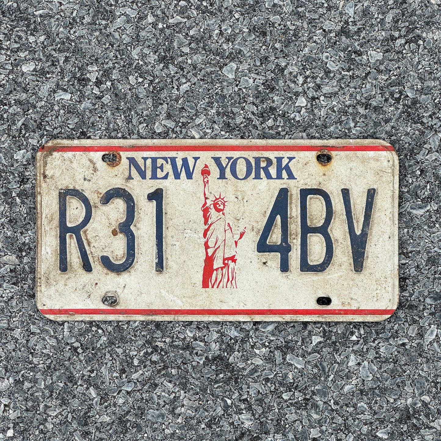 Photo of a 1986 New York License Plate Auto Tag 1 Garage Decor Liberty Base R31 4BV