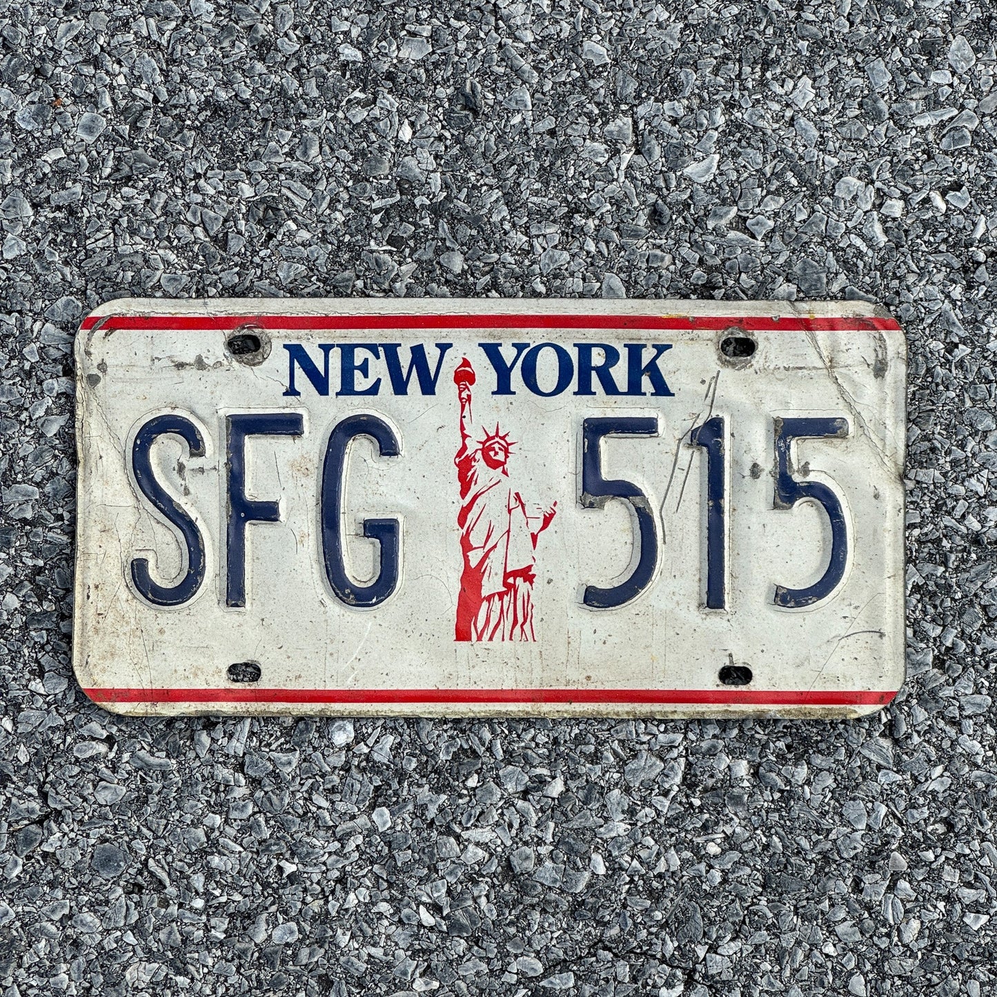 Photo of a 1986 New York License Plate Auto Tag Garage Decor Vintage Liberty Base SFG515