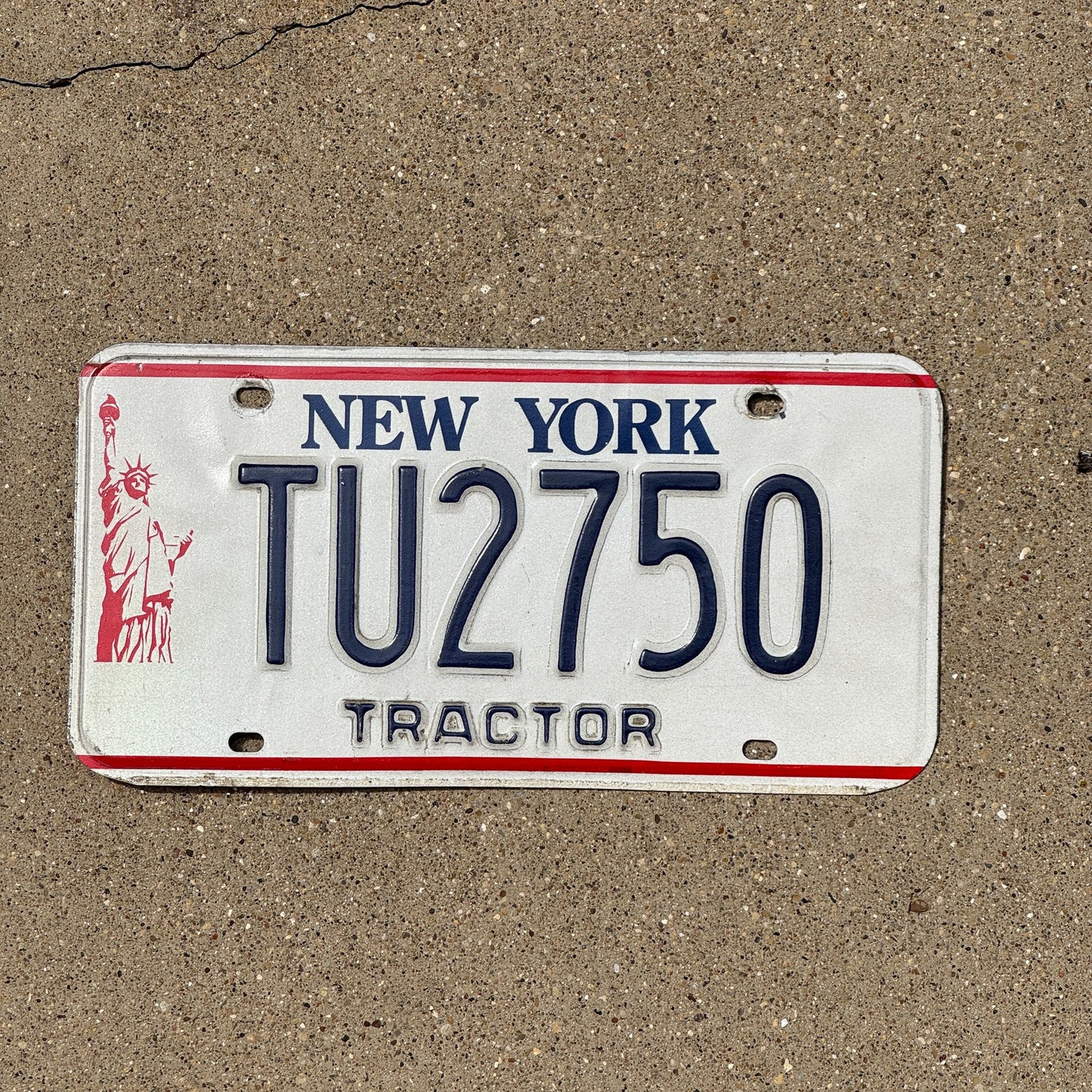 Photo of a 1986 New York Tractor License Plate Auto Tag Garage Decor Vintage TU 2750